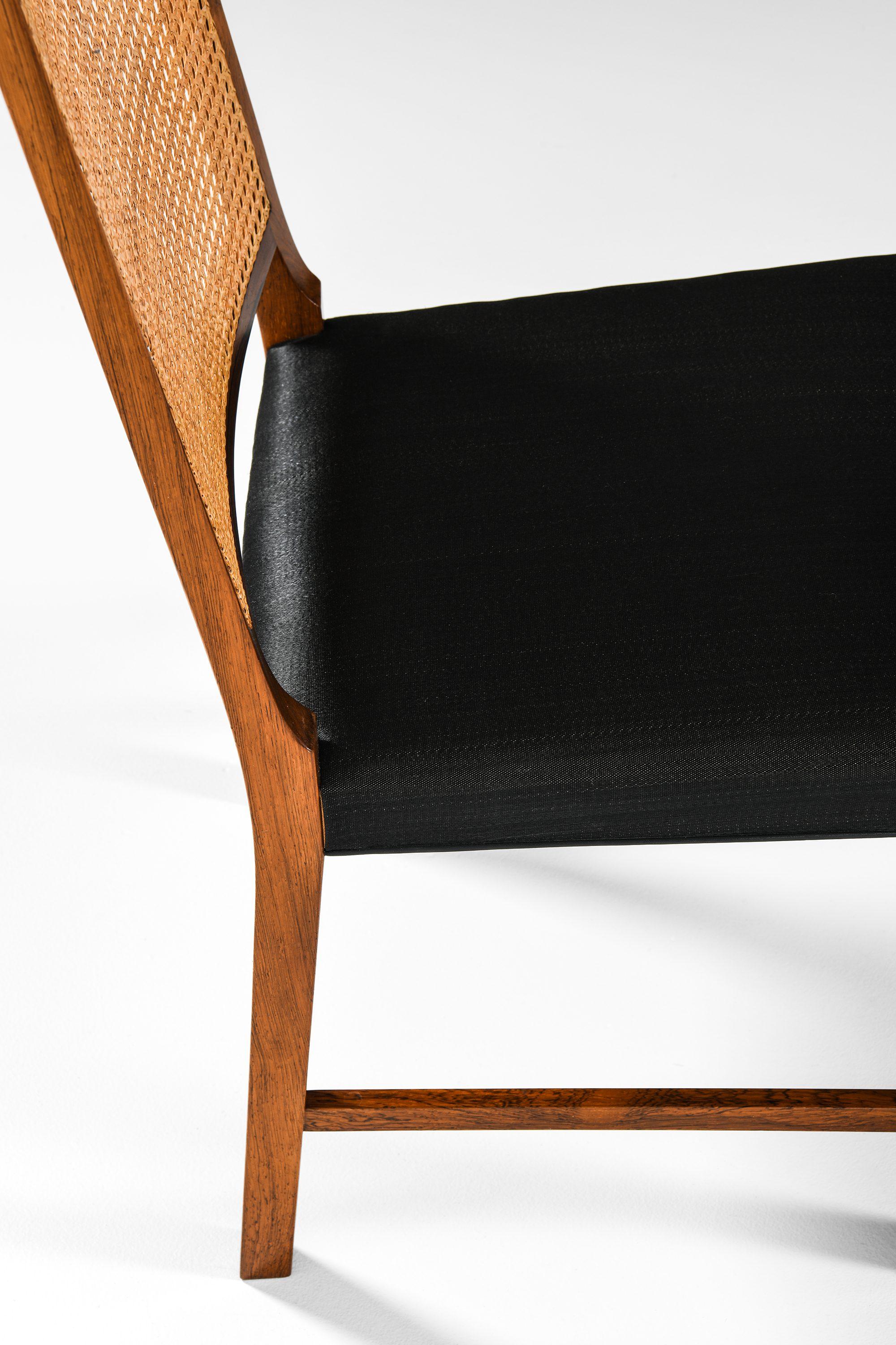 Set of 14 Dining Chairs in Rosewood and Cane by Bernt Petersen, 1960's For Sale 1