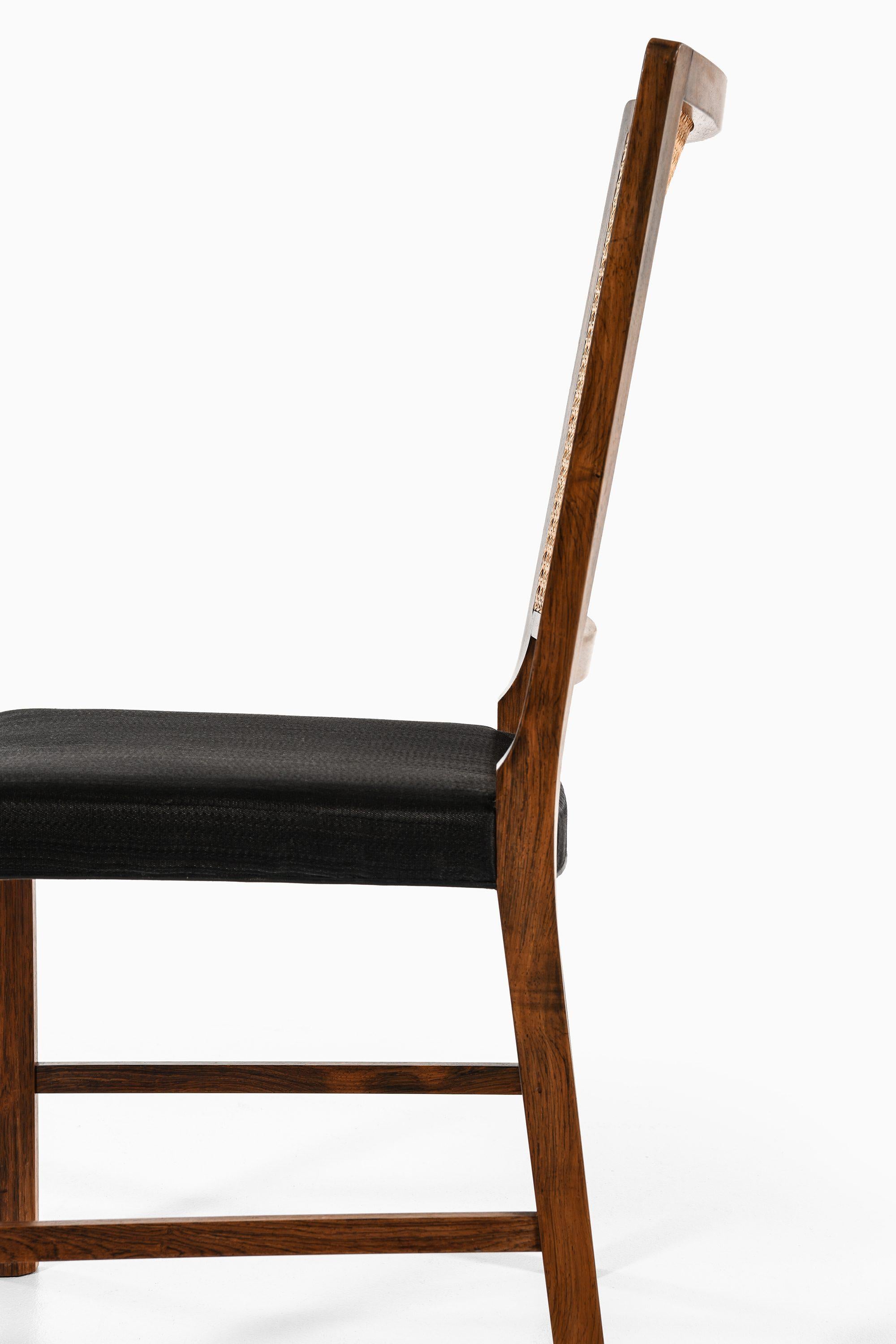 Set of 14 Dining Chairs in Rosewood and Cane by Bernt Petersen, 1960's For Sale 2