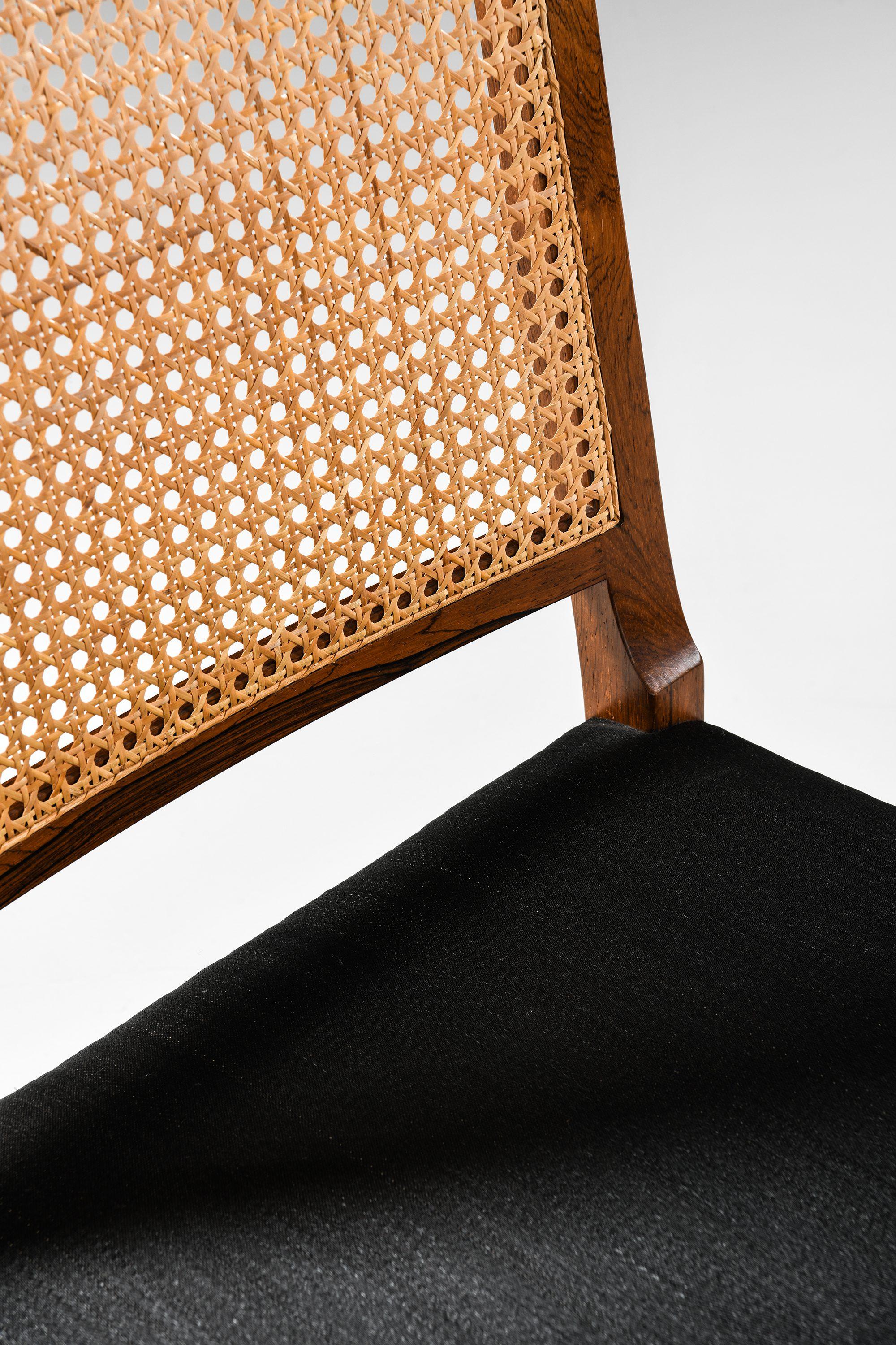 Set of 14 Dining Chairs in Rosewood and Cane by Bernt Petersen, 1960's For Sale 3