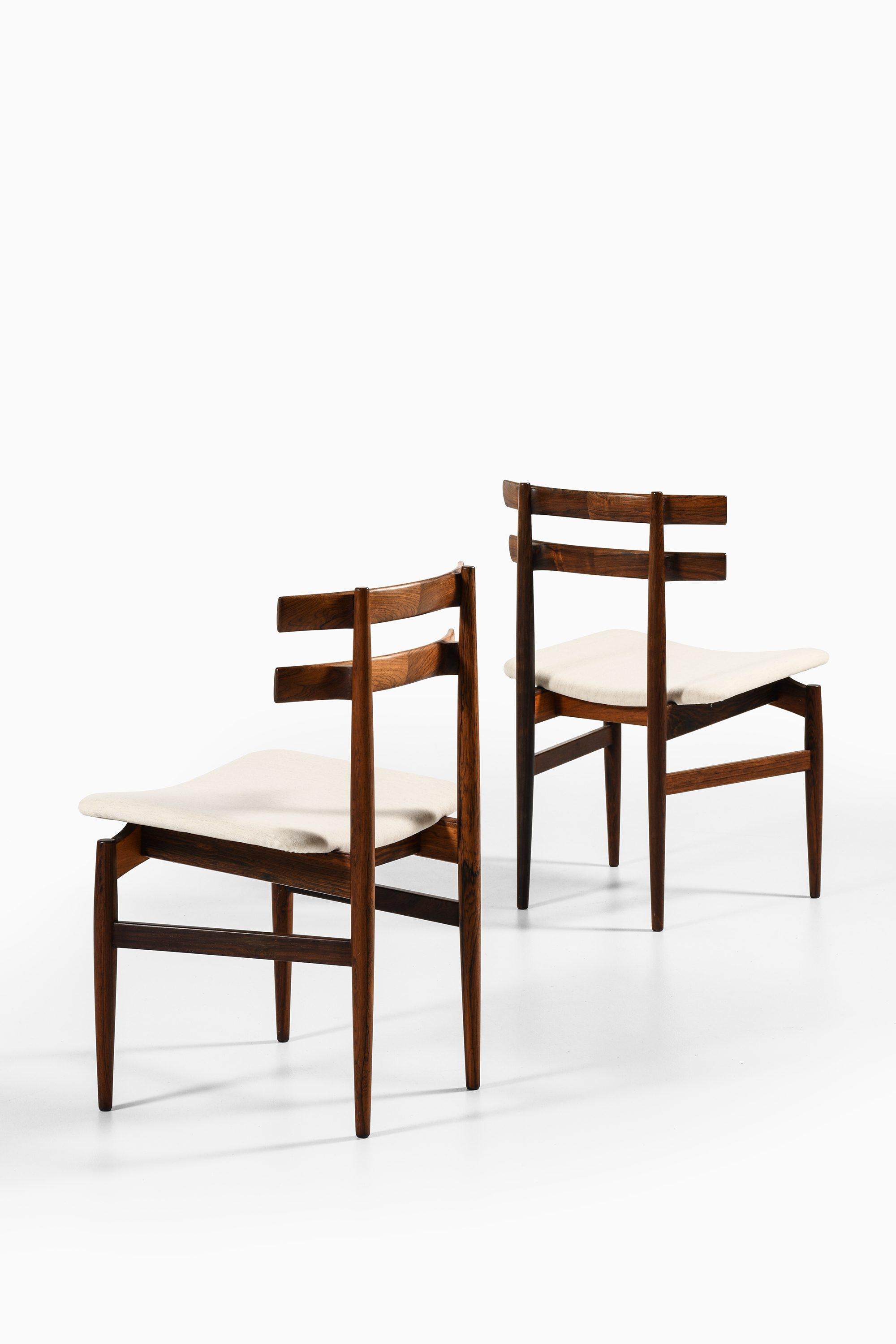 Scandinavian Modern Set of 14 Dining Chairs in Rosewood by Poul Hundevad, 1960's For Sale