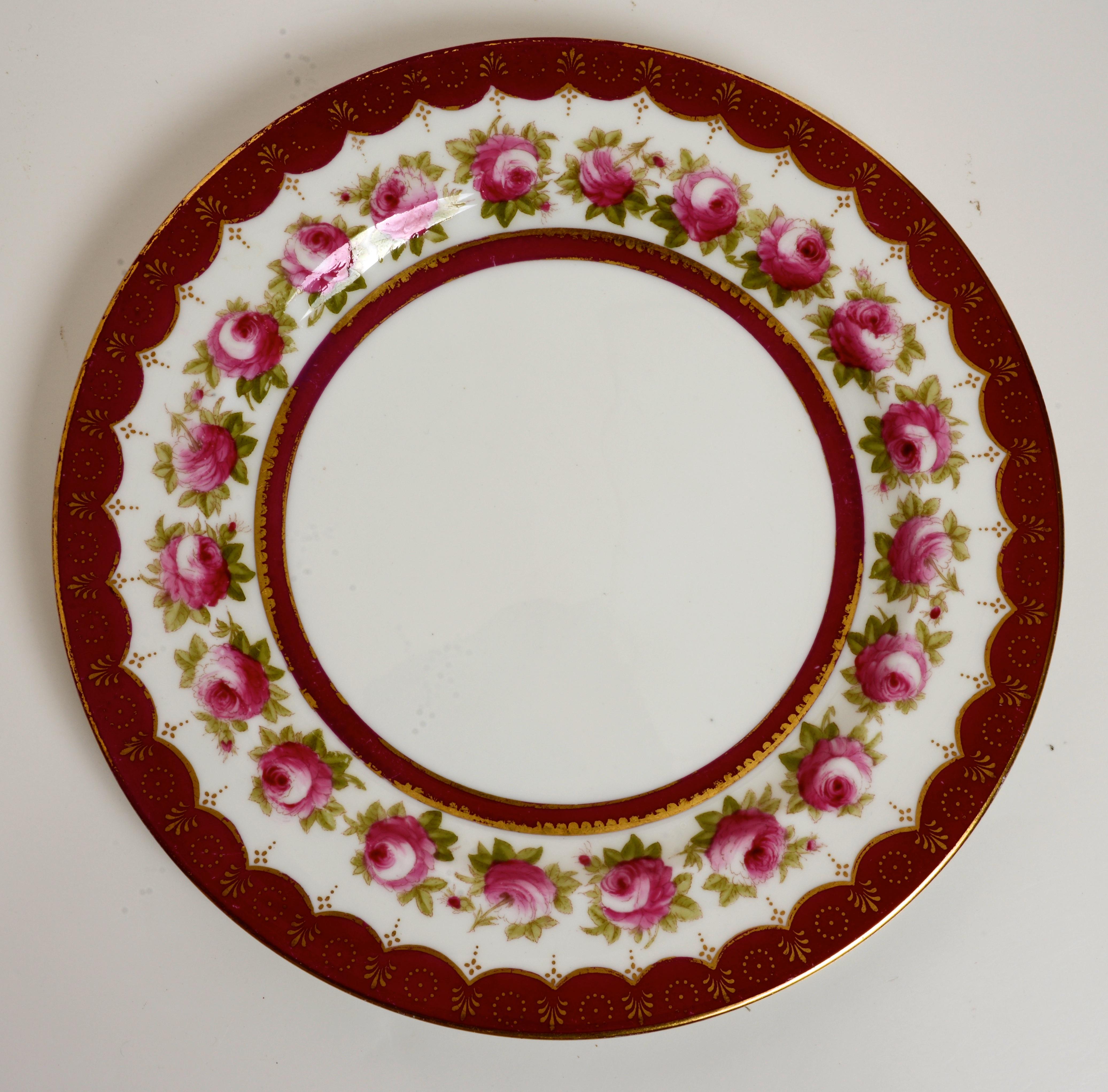 Set of 14 Dinner Plates by Royal Cauldon England in a Rose Pattern. Pattern: Z1302. This is a discontinued pattern. These porcelain plates are a suitable size for the main course of pasta, salad, appetizer, sandwiches and steak.