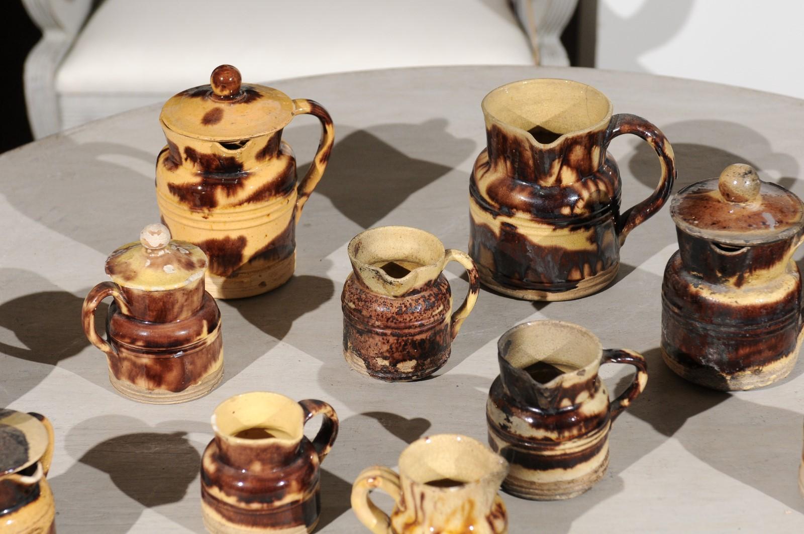 19th Century Set of 14 French Jaspe Pottery Creamers with Molted Mocha Finish, circa 1850