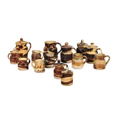 Set of 14 French Jaspe Pottery Creamers with Molted Mocha Finish, circa 1850