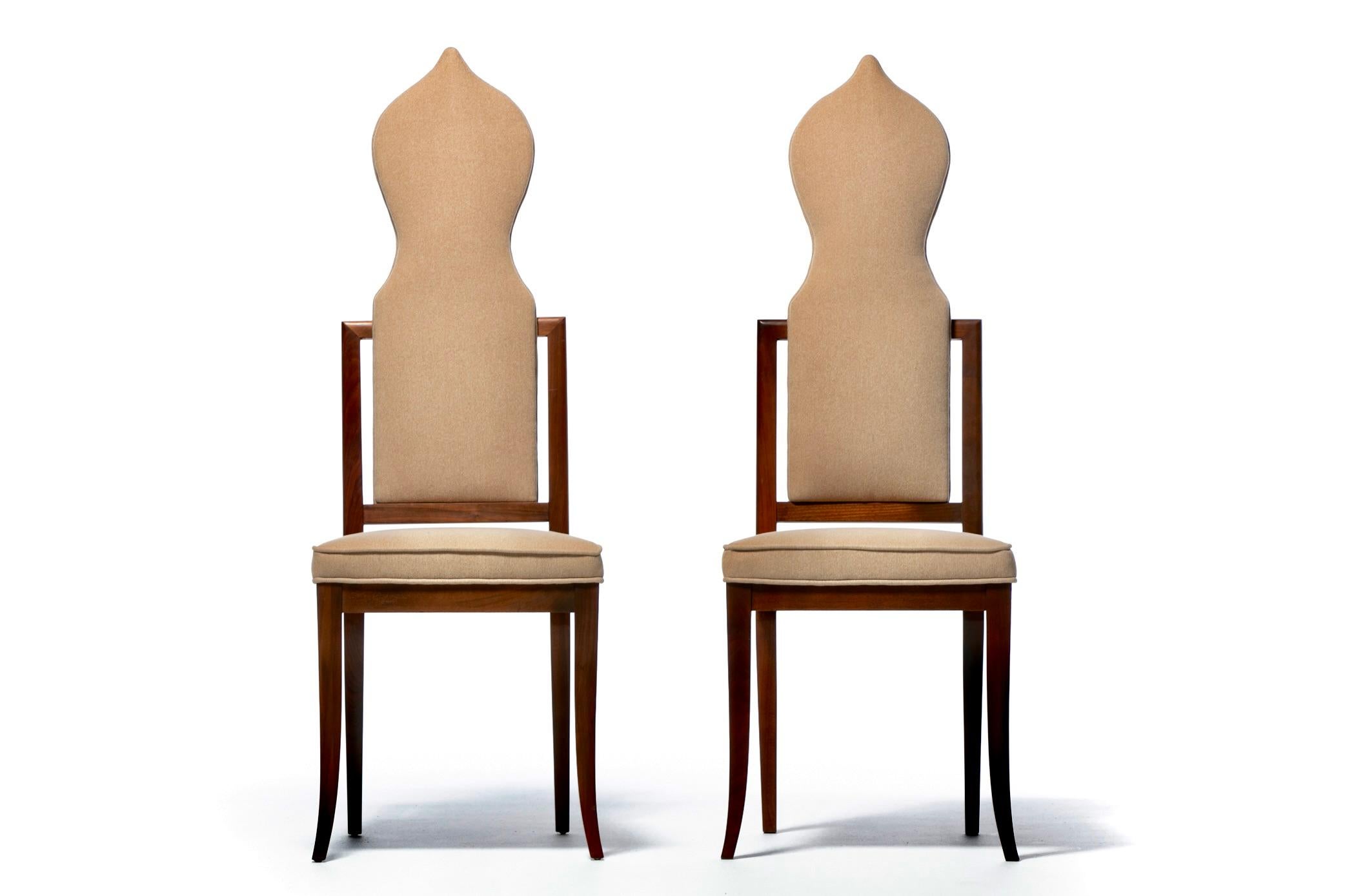 Add up high art and unique sculpture with a sexy Tom Ford dinner party vibe and you get this drop dead gorgeous Set of 14 Tommi Parzinger style Hollywood Regency Walnut Dining Chairs upholstered in soft plush Camel fabric. The profile of this large
