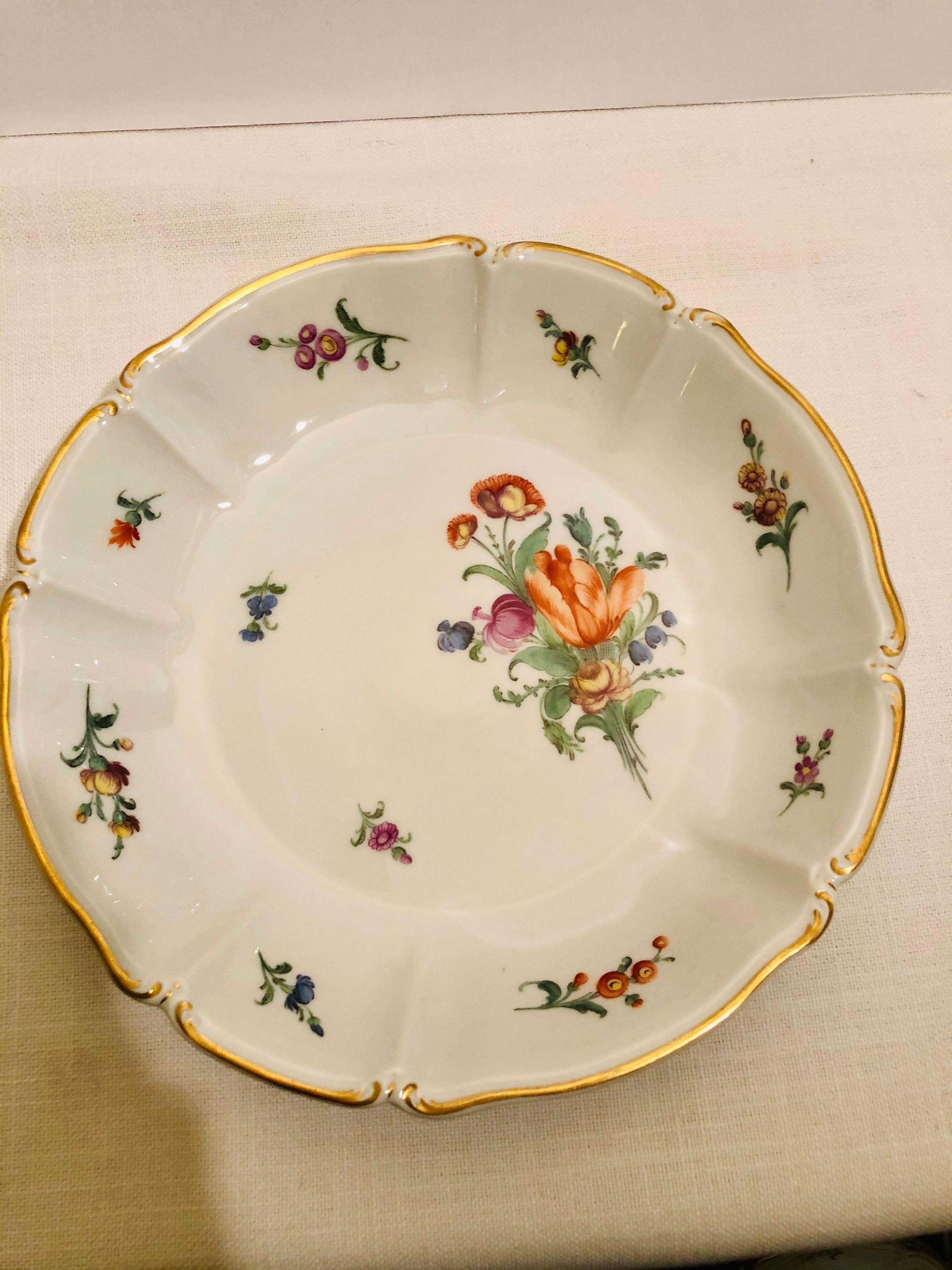 I want to offer you this stunning set of ten Nymphenburg very deep soup bowls. Each of these soup bowls are painted with a different colorful and exquisite flower bouquet. These bowls are much deeper than most wide rim soup bowls. They would be