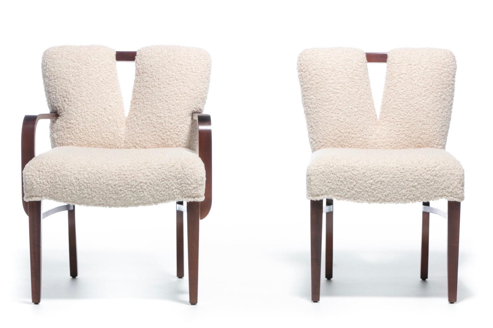 We are pleased to offer this one of a kind exquisitely large set of 14 Paul Frankl plunging corset dining chairs for Johnson Furniture, circa 1950 professionally reupholstered in ivory white bouclé. The backs feature Frankl's iconic 