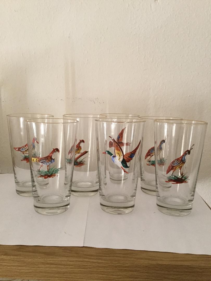 A scarce set of 14 tall highball or water glasses with hand painted enamel birds and with a 3 dimensional look. These birds are actually built up on the glass to give this effect which can be seen in the photographs. There are several different