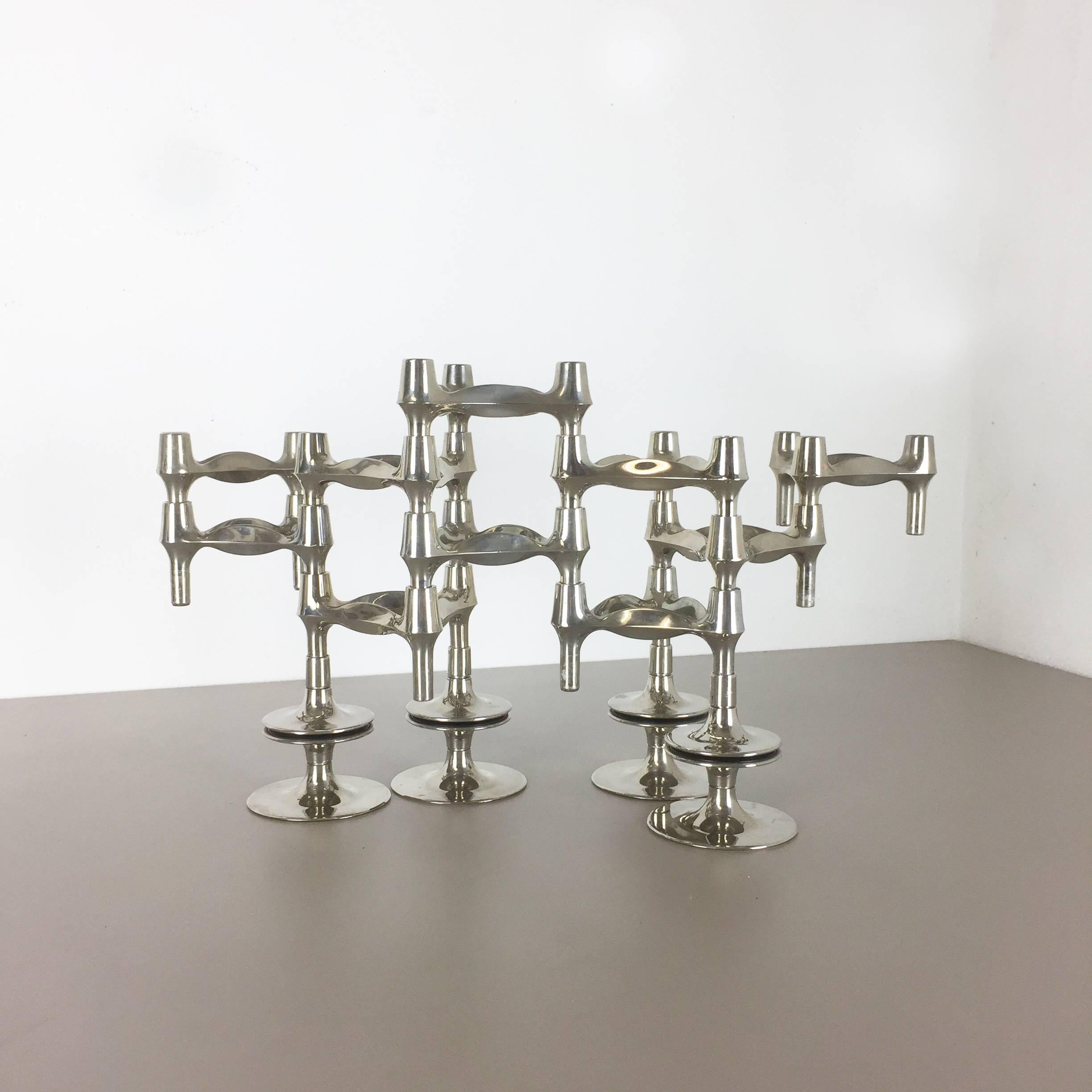 Article:

Ten metal candleholder elements plus four base elements


Producer:

BMF Nagel, Germany


Design:

Caesar Stoffi


This original vintage set of ten metal candleholders plus four base elements, was produced in the 1970s in