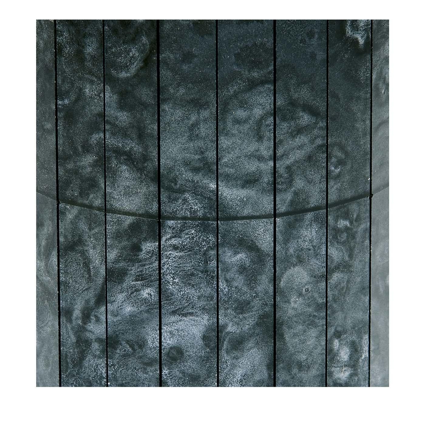 The dark and smokey gray swirls of these canvased mosaic glass panele have an almost hypnotic effect. Using ancient inspiration for a very modern object, this decorative modular panel is a perfectly moody and profound addition to any modern home.