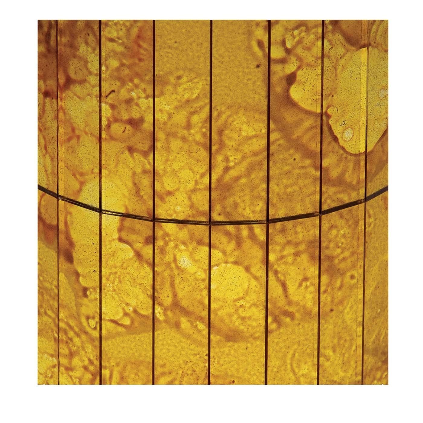 The bright, billowing shades of yellow and gold make for a luminous result on these canvased mosaic glass panels by Antique Mirror. This luminous decoration will add an ambiance of earthly mystery as well as elegant brilliance to any modern or