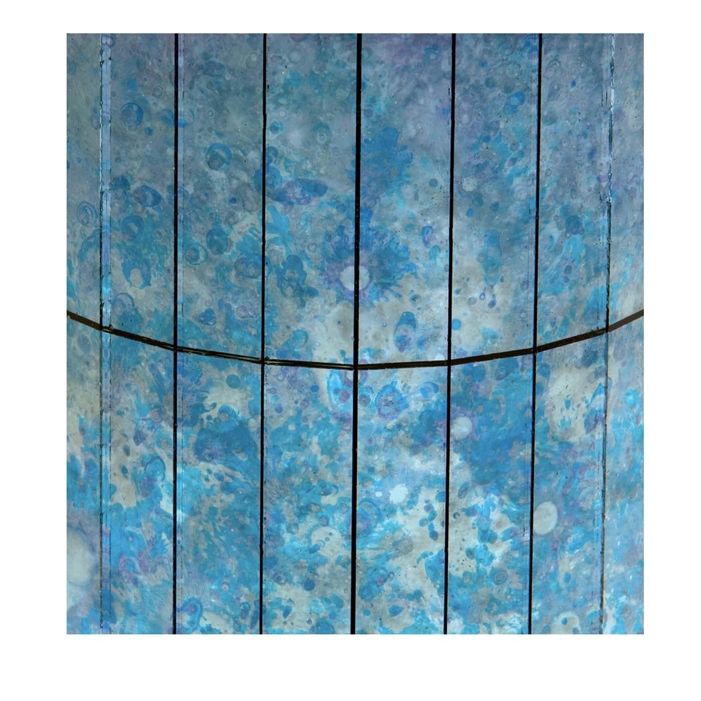 The heavenly cobalt blue color of these canvased decorative panels made of mosaic glass tiles is another masterpiece made by the artisans at Antique Mirror. The varying shades of blue, purple, and white on the glass make for a shining display on any