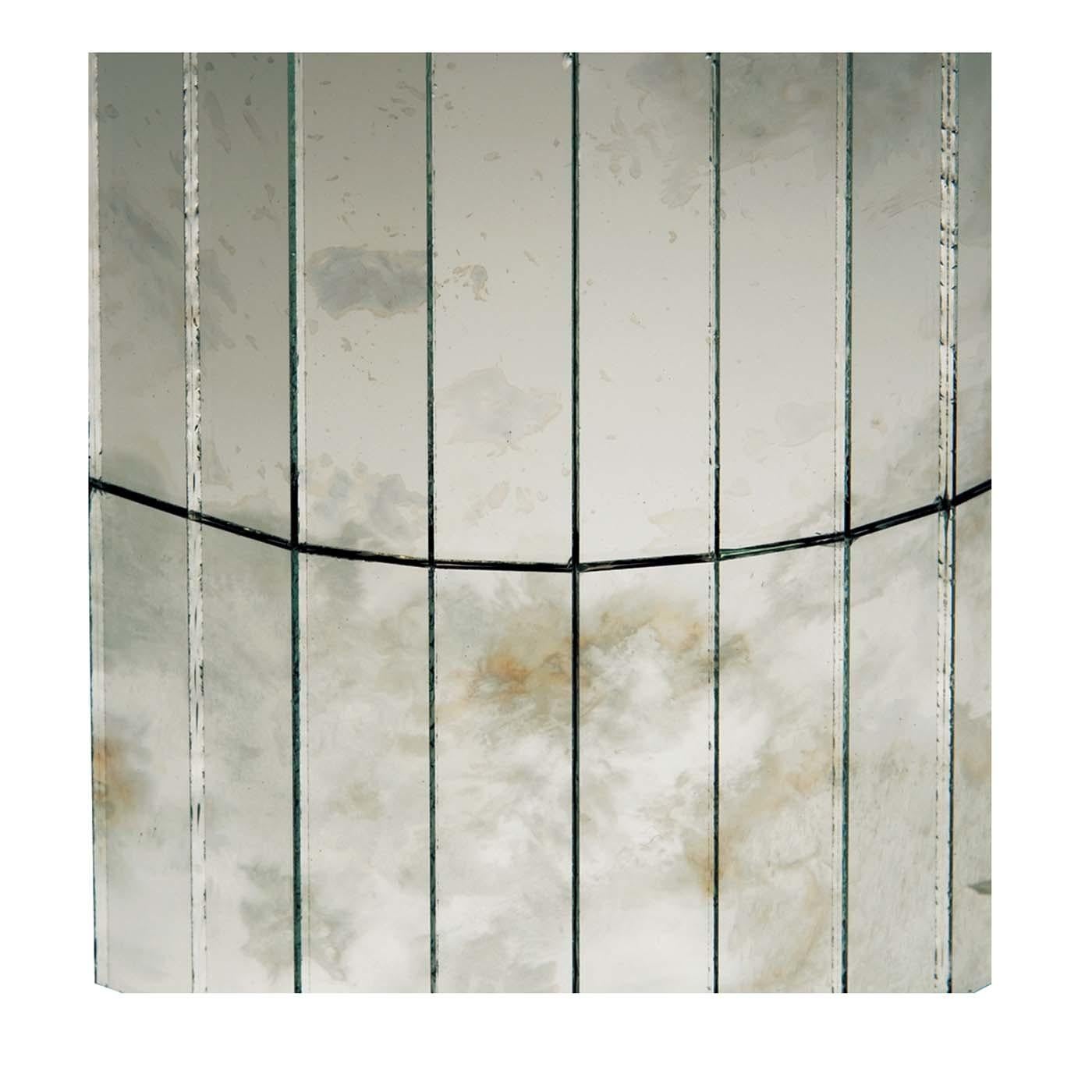 The gray and dust speckled hues on these canvased mosaic glass panels by Antique Mirror evoke the icy gasses of the namesake ringed planet in our solar system. These muted and tenuous tones complement any wall or surface in a minimalist or modern
