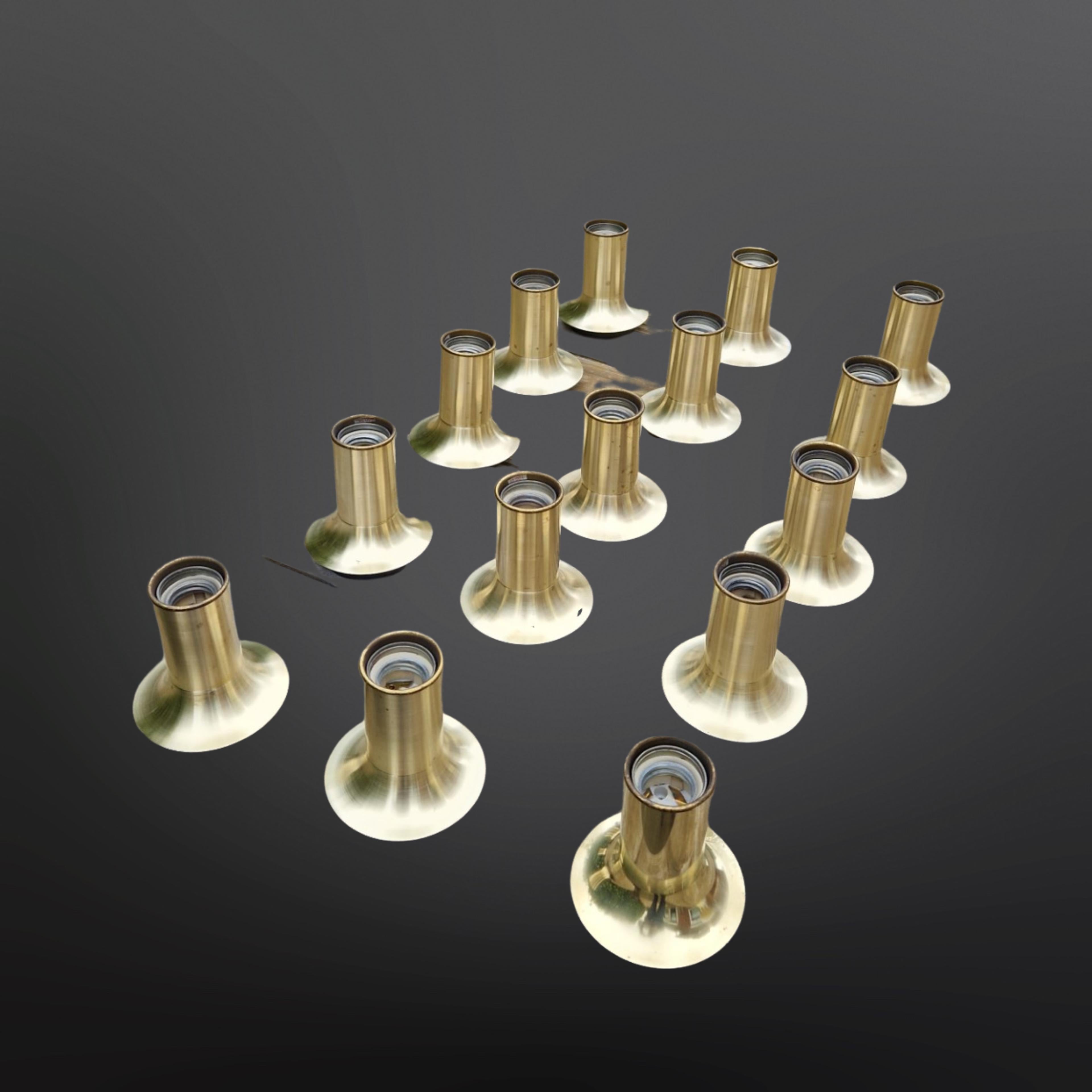 Large set of 15 space age flush mount lamps. The have a trumpet or tulip style shape. The measure 10cm in diameter and 11 cm in height (height measured without a bulb). Suitable for e27 LED, halogen and normal bulbs.
Made by German company Cosack in