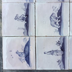 Set di 16 piastrelle Delft bianche e blu con animali e figure, XVIII secolo