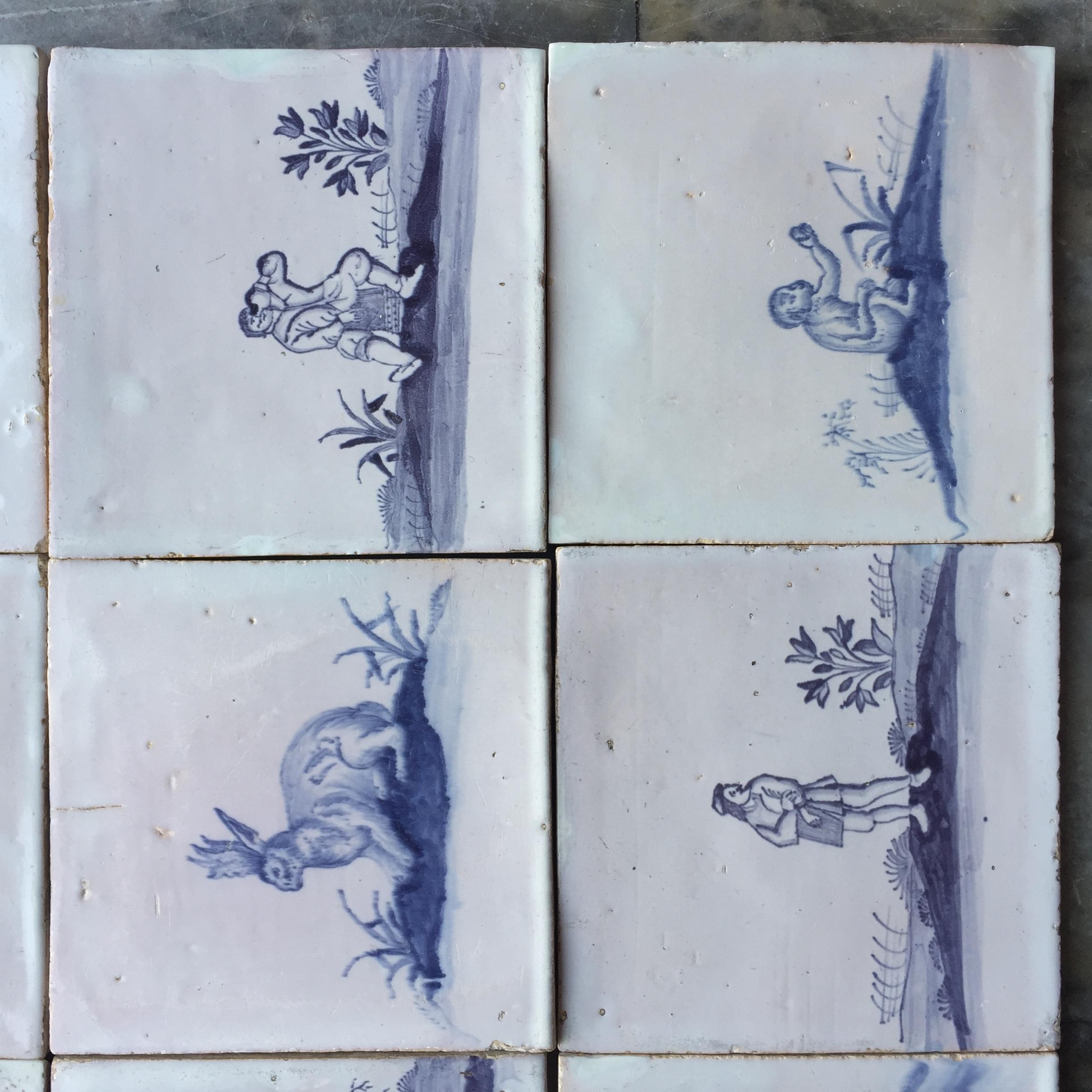 Hand-Painted Set of 16 Blue and White Delft Tiles with Animals and Figures, 18th Century For Sale