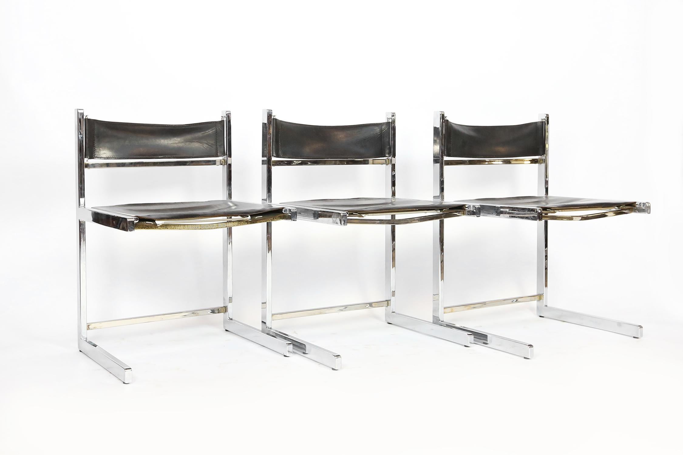 Unique 1970s Italian dining chairs in a cubist shape.
Made of chrome-plated metal and tan leather in great condition.
In total 16 pieces available, priced per piece.
   
