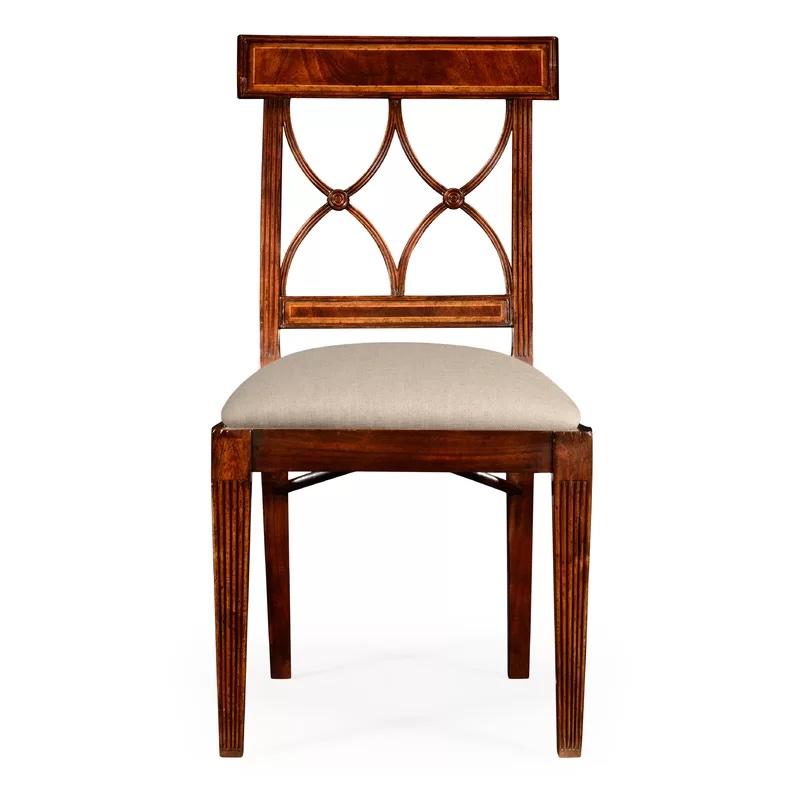 Set of 16 classic regency style dining chairs, featuring banded upper and lower curved back rails, with twin opposing lancet arch splats between. Walnut frames with cotton upholstered seats. Set includes 2 armchairs and 14 side chairs. 
Side