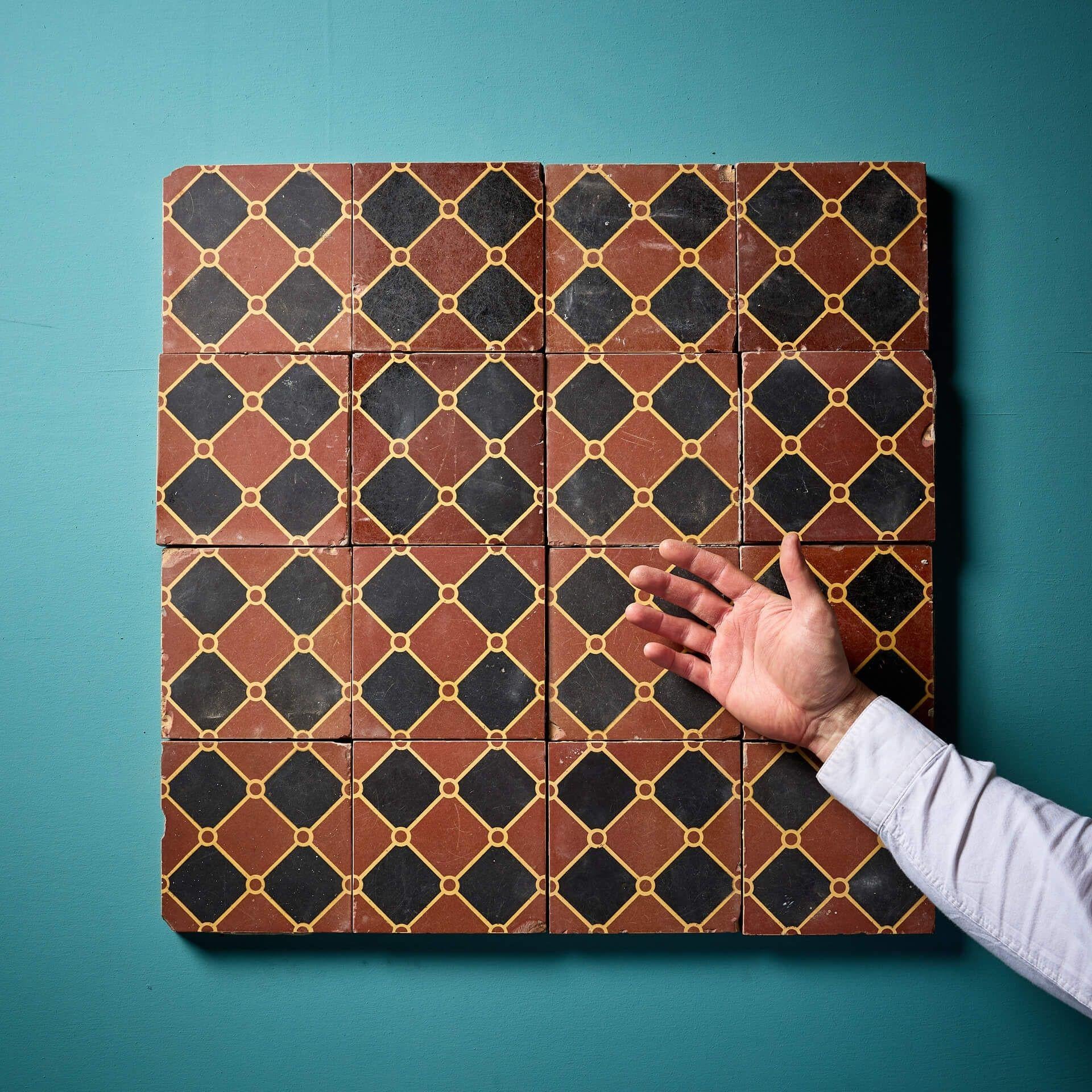A set of sixteen 6-inch reclaimed encaustic tiles with red and black chequerboard pattern interwoven with buff lines by W. Godwin of Lugwardine, Hereford (indistinctly stamped).

Dating from the mid 19th century, these antique encaustic tiles are in