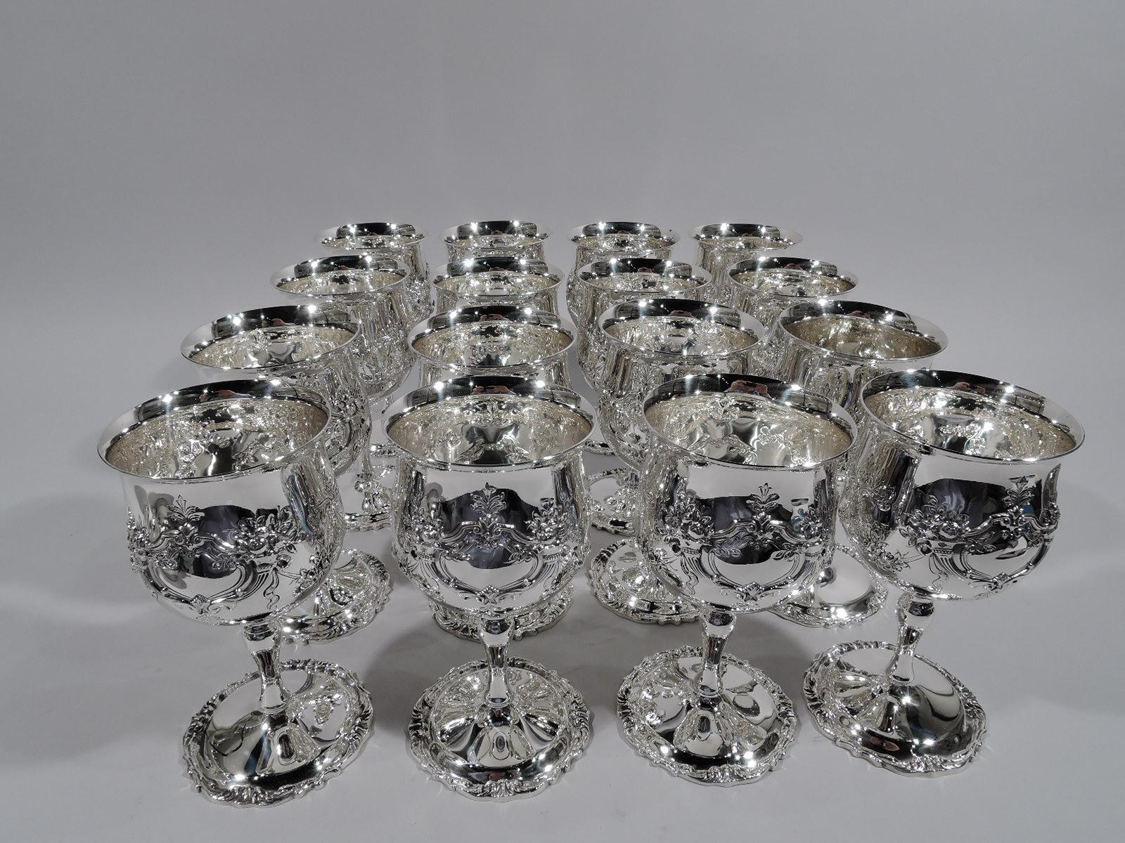 Set of 16 sterling silver goblets in Francis I pattern. Made by Reed & Barton in Taunton, Mass. Bowl has flared rim and rests on baluster stem mounted to raised foot. Strapwork and cornucopia cartouches (vacant) joined by floral garlands. Scrolls