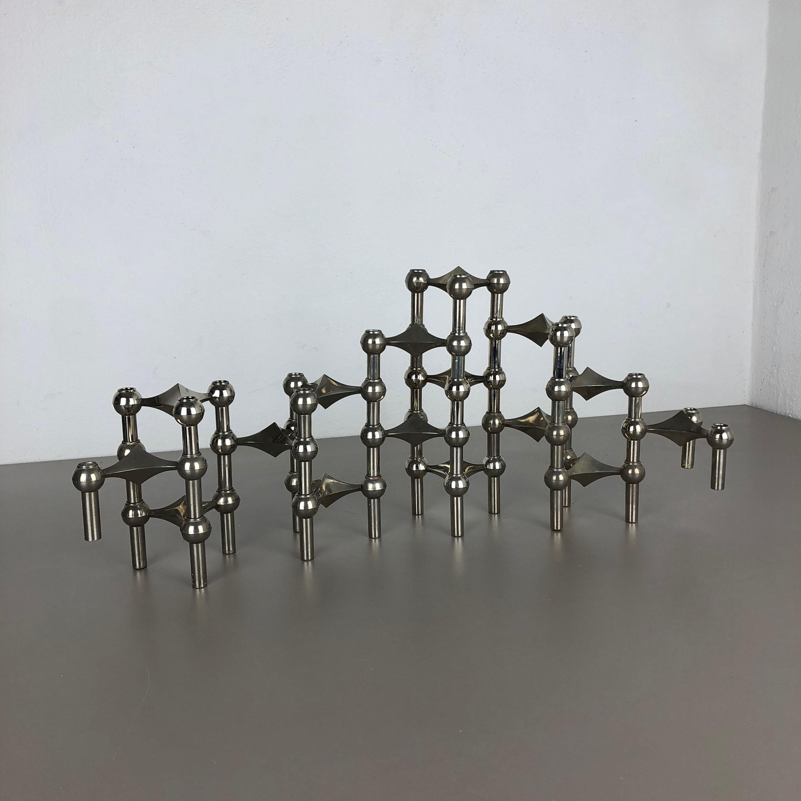 Article:

16 metal candleholder elements


Producer:

BMF Nagel, Germany





This original vintage set of 16 metal candleholders was produced in the 1970s in Germany by BMF Nagel. Due to the 3 stacking option of each candle stick, it