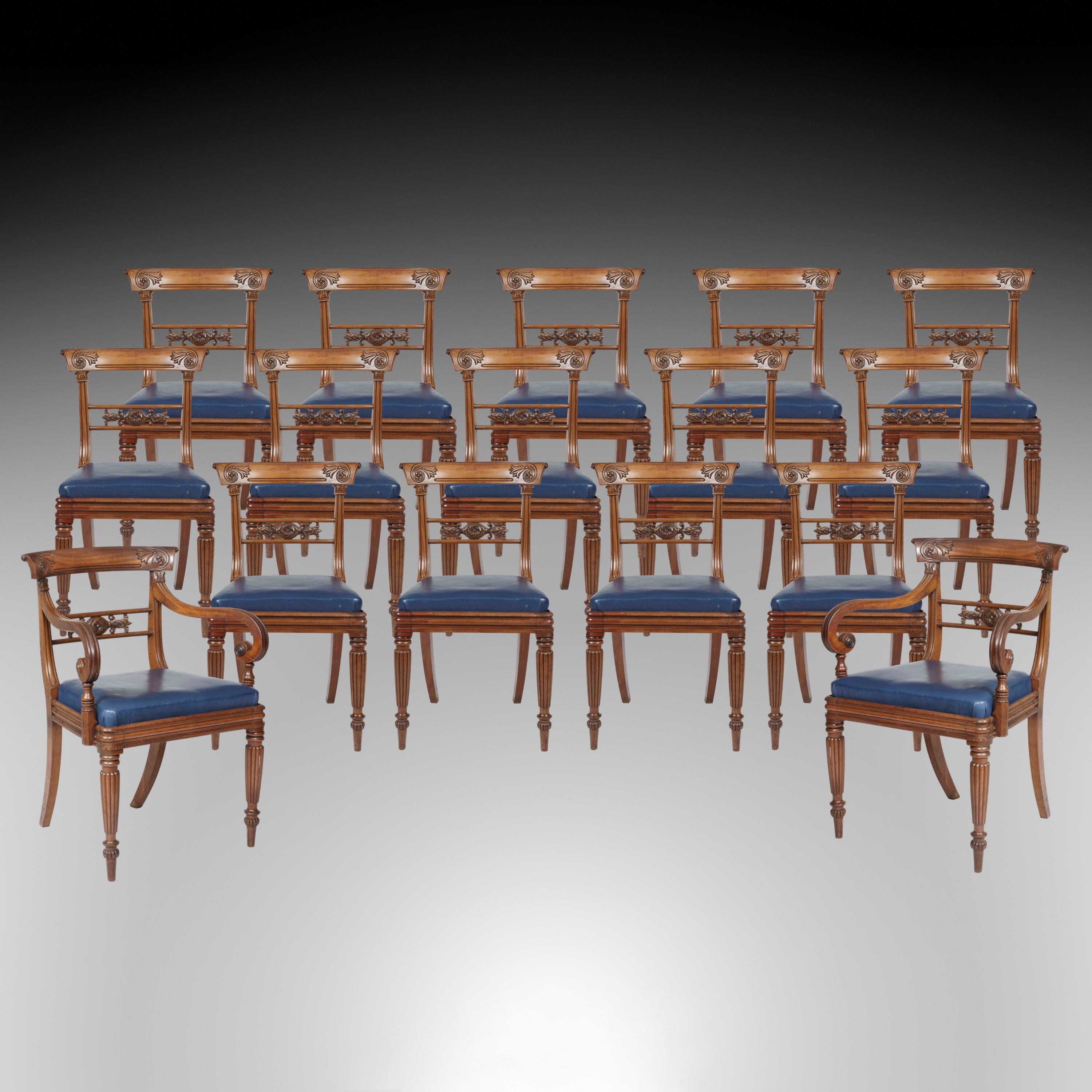 A Set of Sixteen Dining Chairs of the William IV Period

Constructed in mahogany, and consisting of fourteen side chairs, and a pair of carver armchairs. Rising from ring turned, tapering and lobed front feet, having sabre legs to the rear, with the