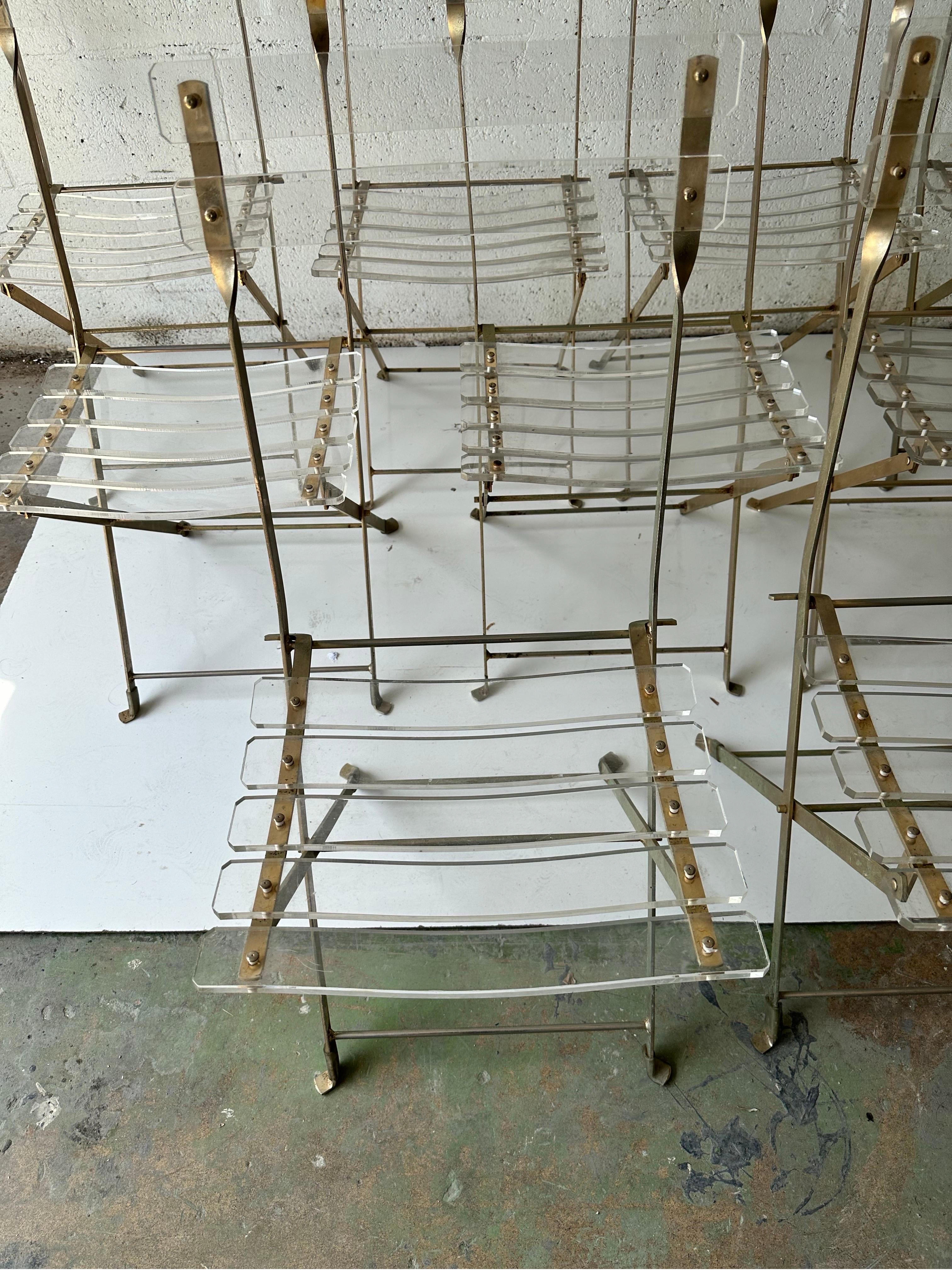 Fantastic set of 16 Lucite folding chairs by Yonel Lebovici, in brass plated steel and Lucite.  For Marais International, Edition du Marais. Circa 1970.