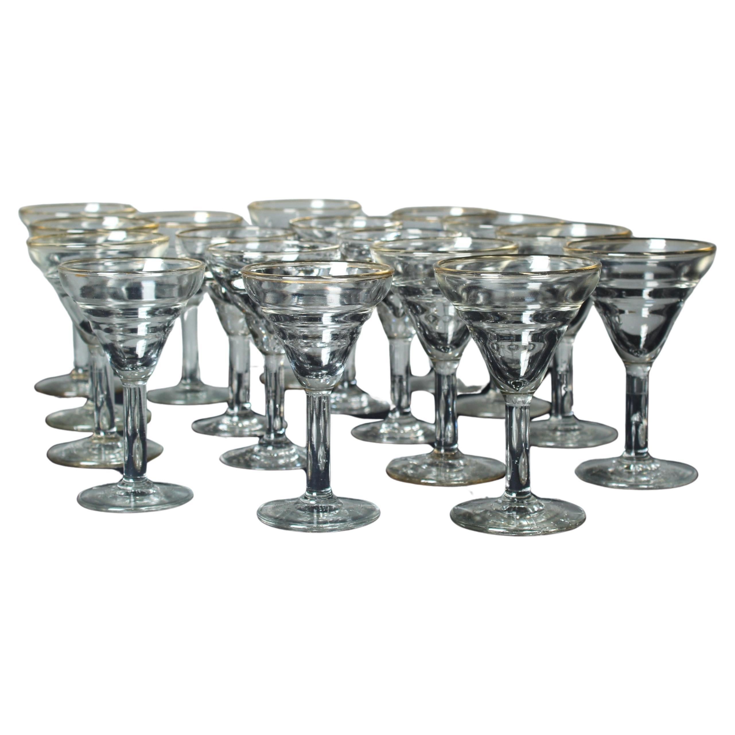 A beautiful set of seventeen aperitif or so-called bistrot glasses with golden details.
All unique and mouth-blown.

At the turn of the 20th century, the French culture of fine dining and socialising flourished, leading to the emergence of a symbol