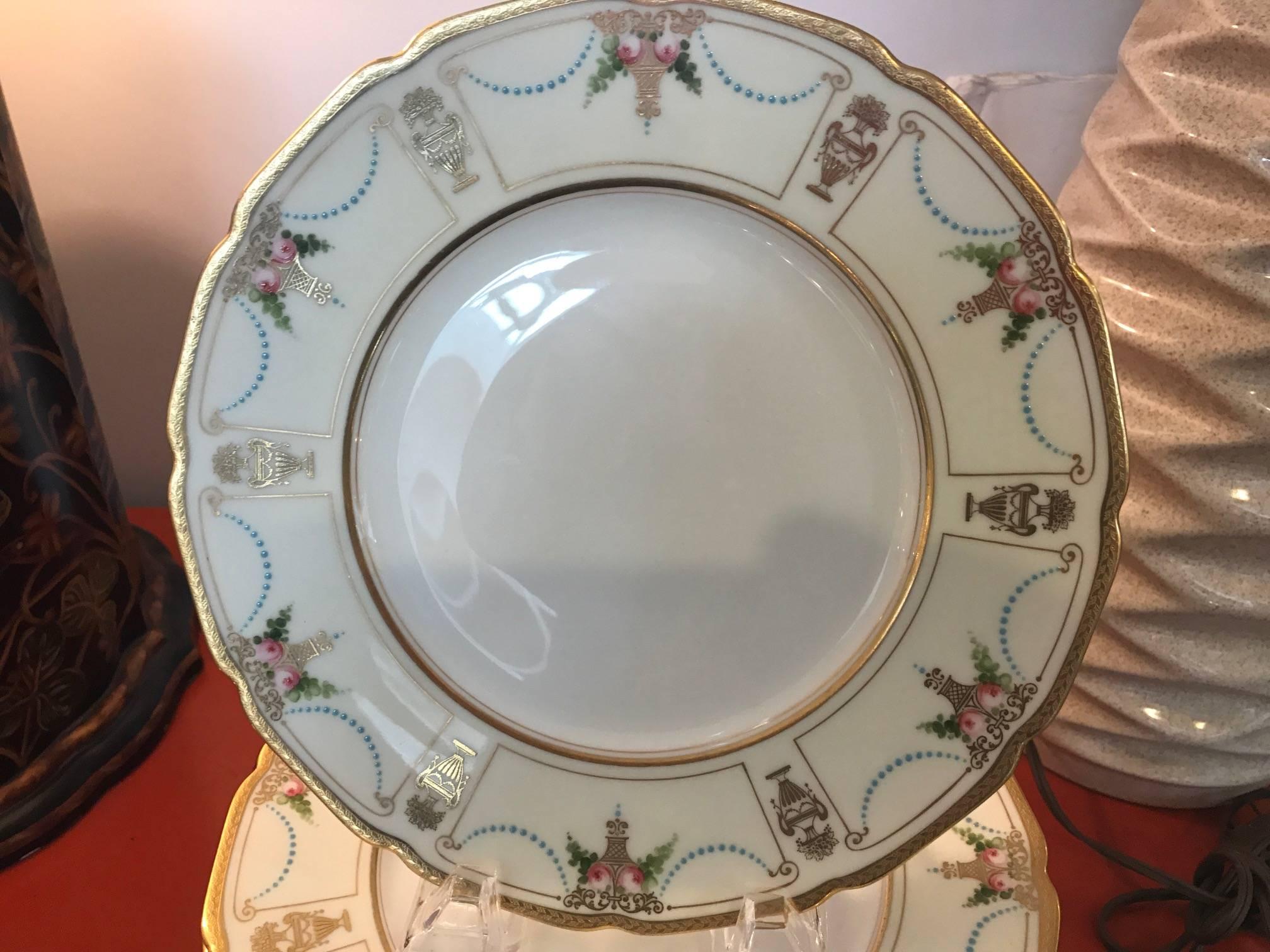 Graceful Edwardian era 9 inch hand painted accent plates in the early 20th century Lenox green mark with a year mark of 1915. The elegant plates were made for and retailed by Tiffany's New York.