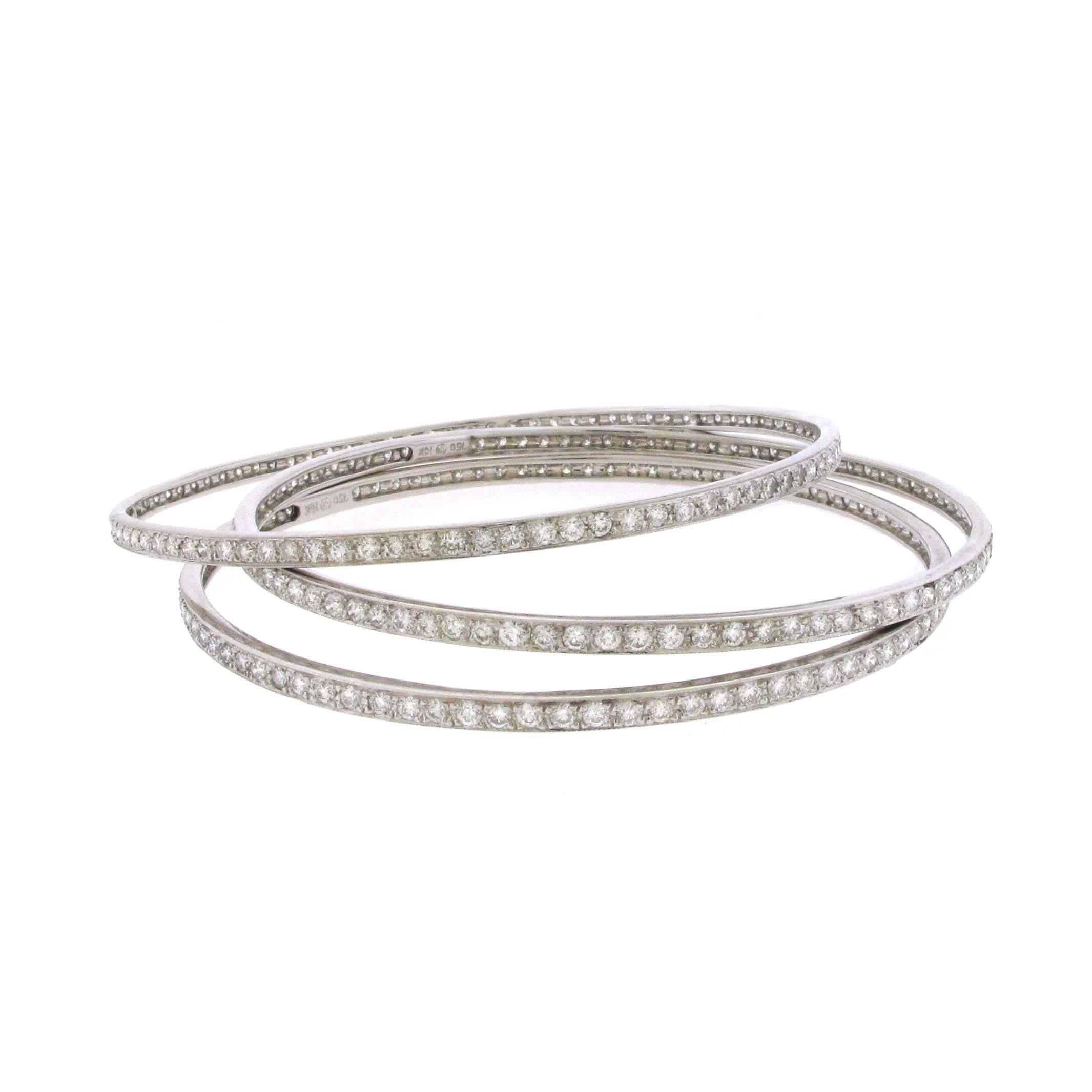 Three (3) channel set 18 karat white gold diamond bangle bracelets. There is are approximately 9.50 carats of diamonds. Each bracelet has over 3 carats of diamonds. They can be stacked together or worn individually. The color of the diamonds are H-I