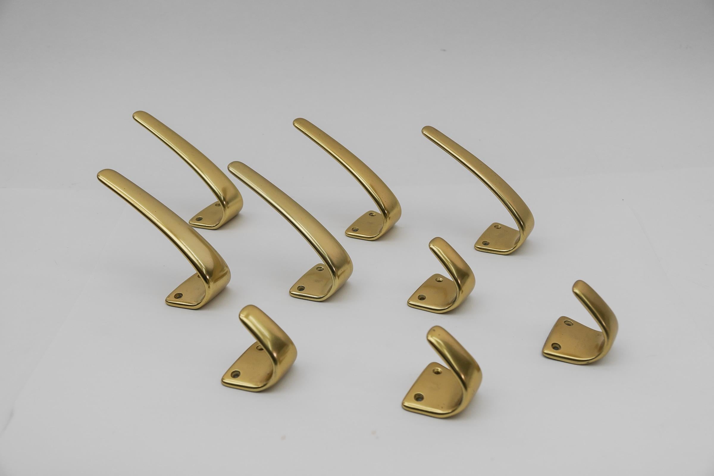 Mid-20th Century Set of 18 Midcentury Brass Wall Hooks, Austria, 1950s For Sale