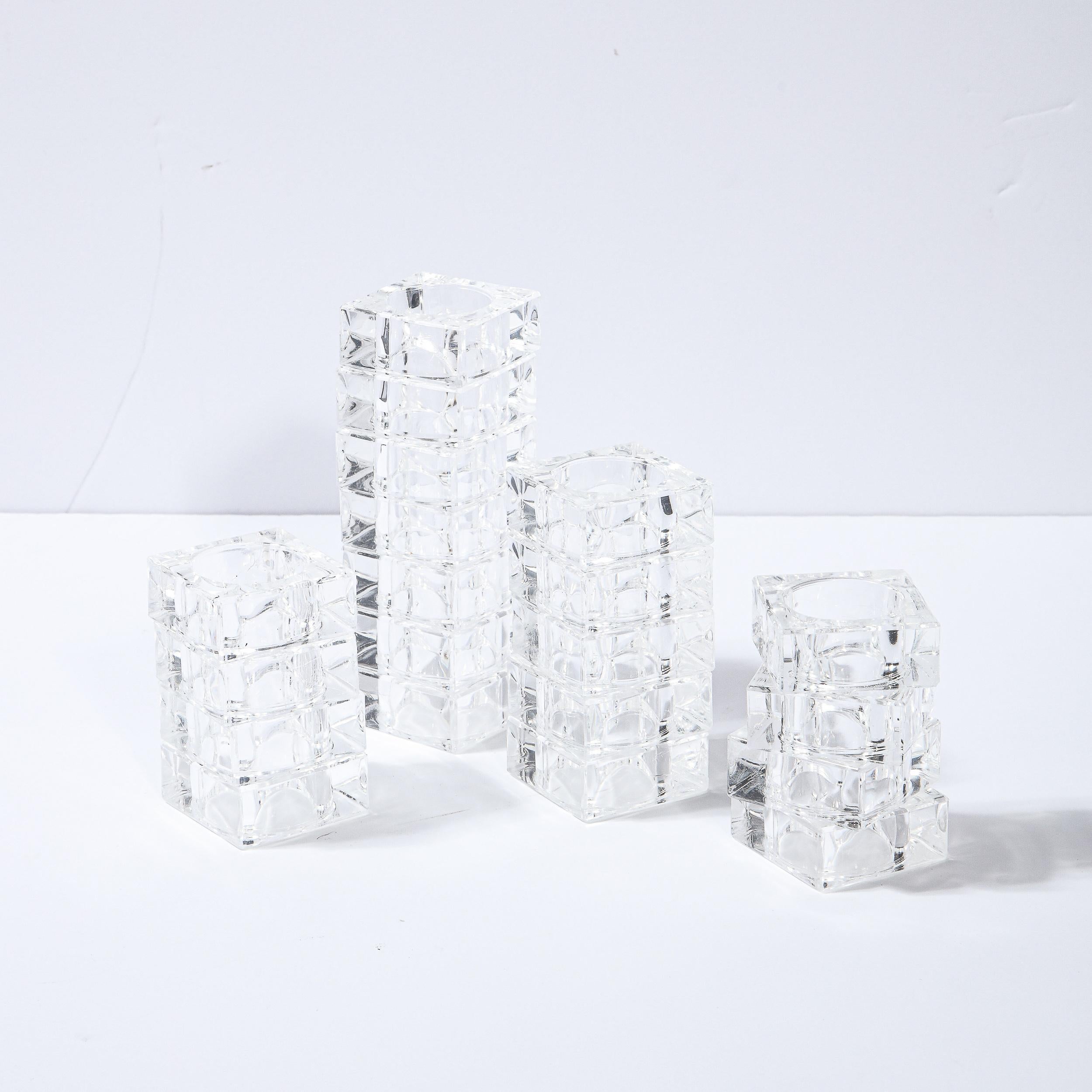 This stunning set of 18 Mid-Century Modern napkin holders were realized in the United States circa 1970. They feature square bodies in translucent lucite with circular cut outs in the center of each. With their clean modernist lines and