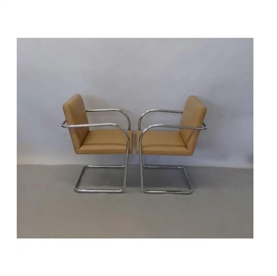 Completely restored set of eighteen tubular Brno chairs by Mies van der Rohe for Knoll. Professionally re-upholstered in camel color and the chrome is in great condition. 