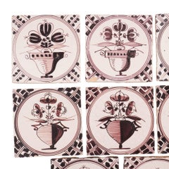 Set of 18 mulberry decorated Delft tiles, 1700's