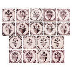 Set of 18 mulberry decorated Delft tiles, 1700's