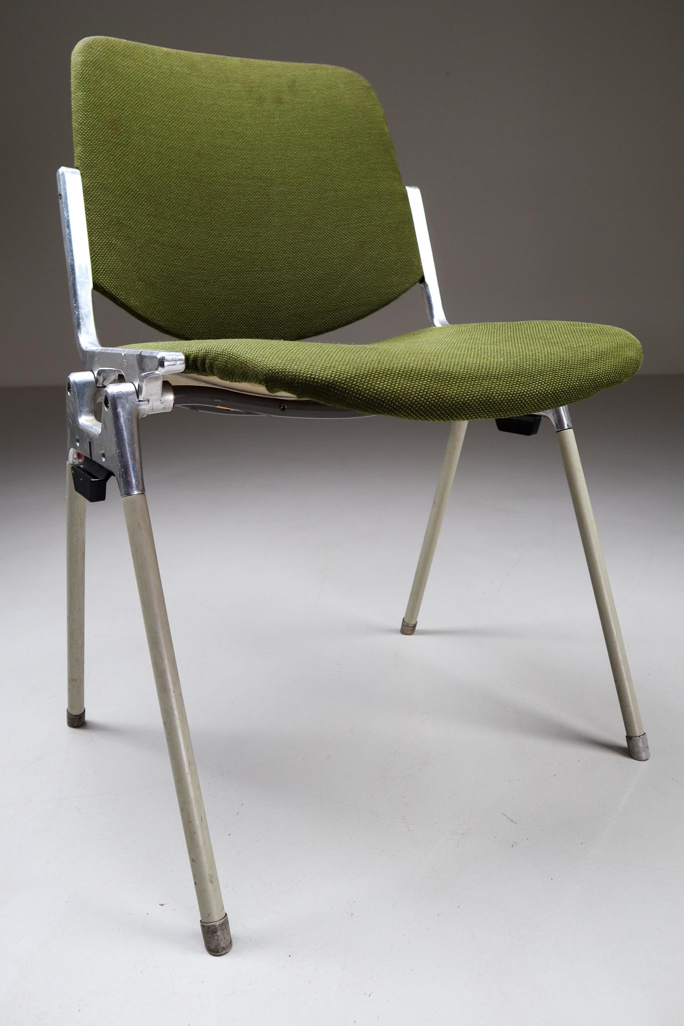 Set of 18 iconic DSC 106 stacking chairs, designed 1965 by Giancarlo Piretti for Castelli. This set features original Italian olive green fabric seats and backs and soft green legs, they are in very nice condition with a signs of wear due to their