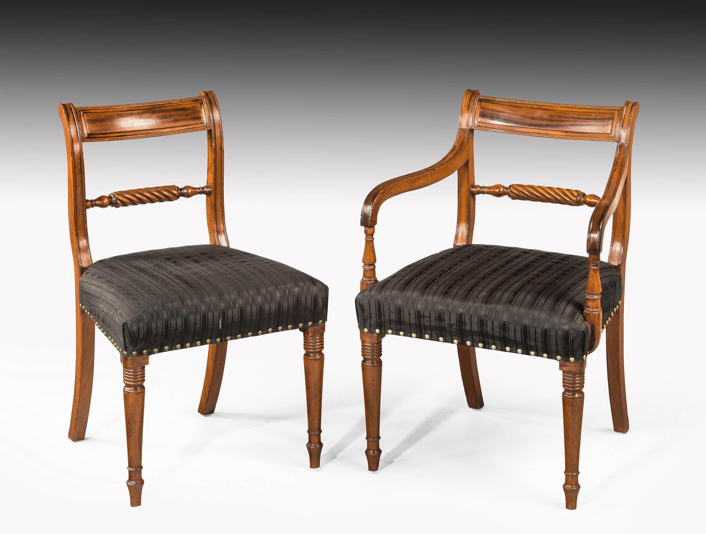 A quite exceptional set of 18 Regency period mahogany framed chairs. On tapering well turned supports. The back with Trafalgar rope twist centre splat. In quite extraordinary good original condition including all the surfaces and polish. 

Measure:
