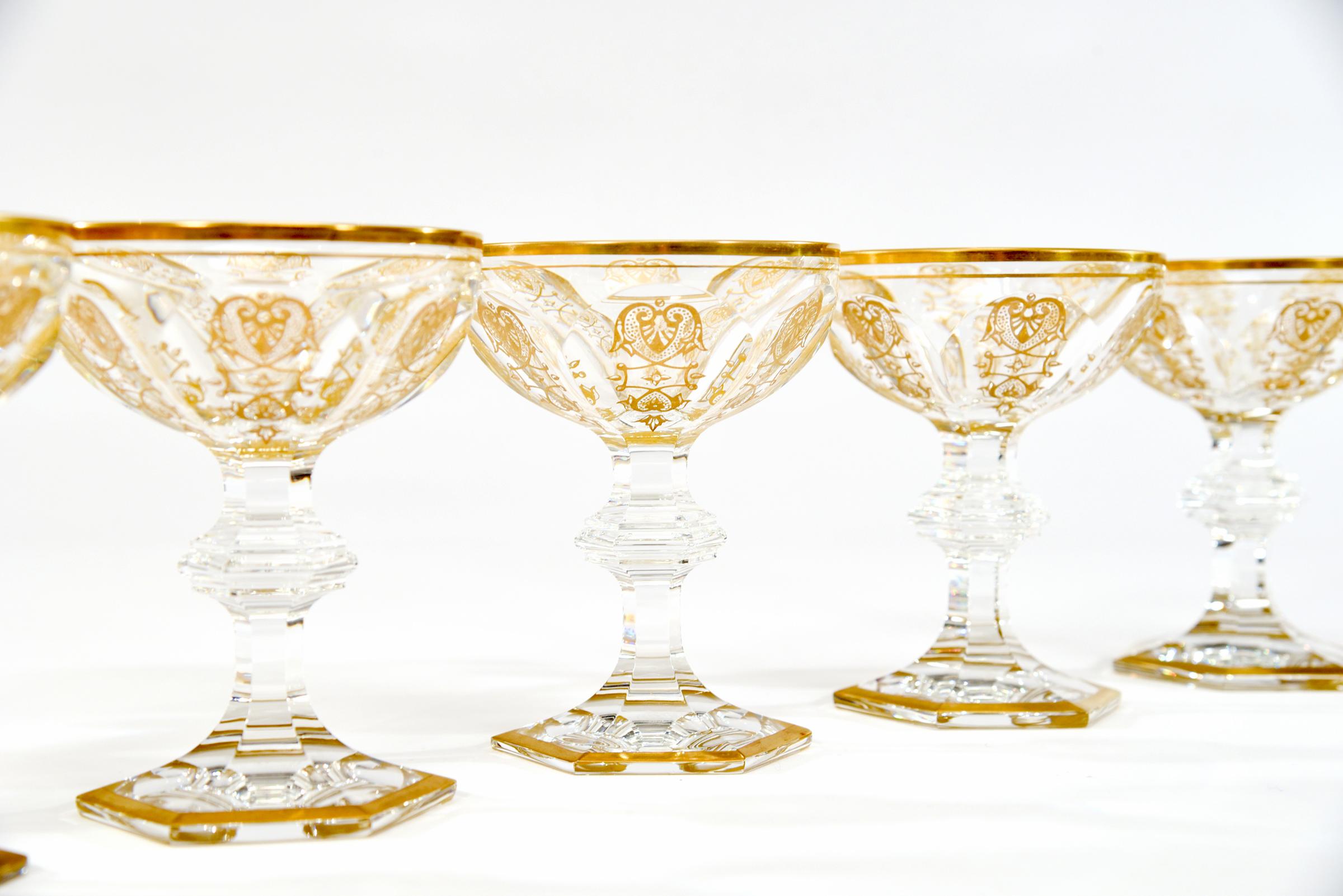 Featuring a gorgeous set of 18 signed Baccarat hand blown crystal martini or champagne coupes in the elaborate Empire pattern. Because these are so tall and large, they can also be used as a footed compote for your favorite dessert or first
