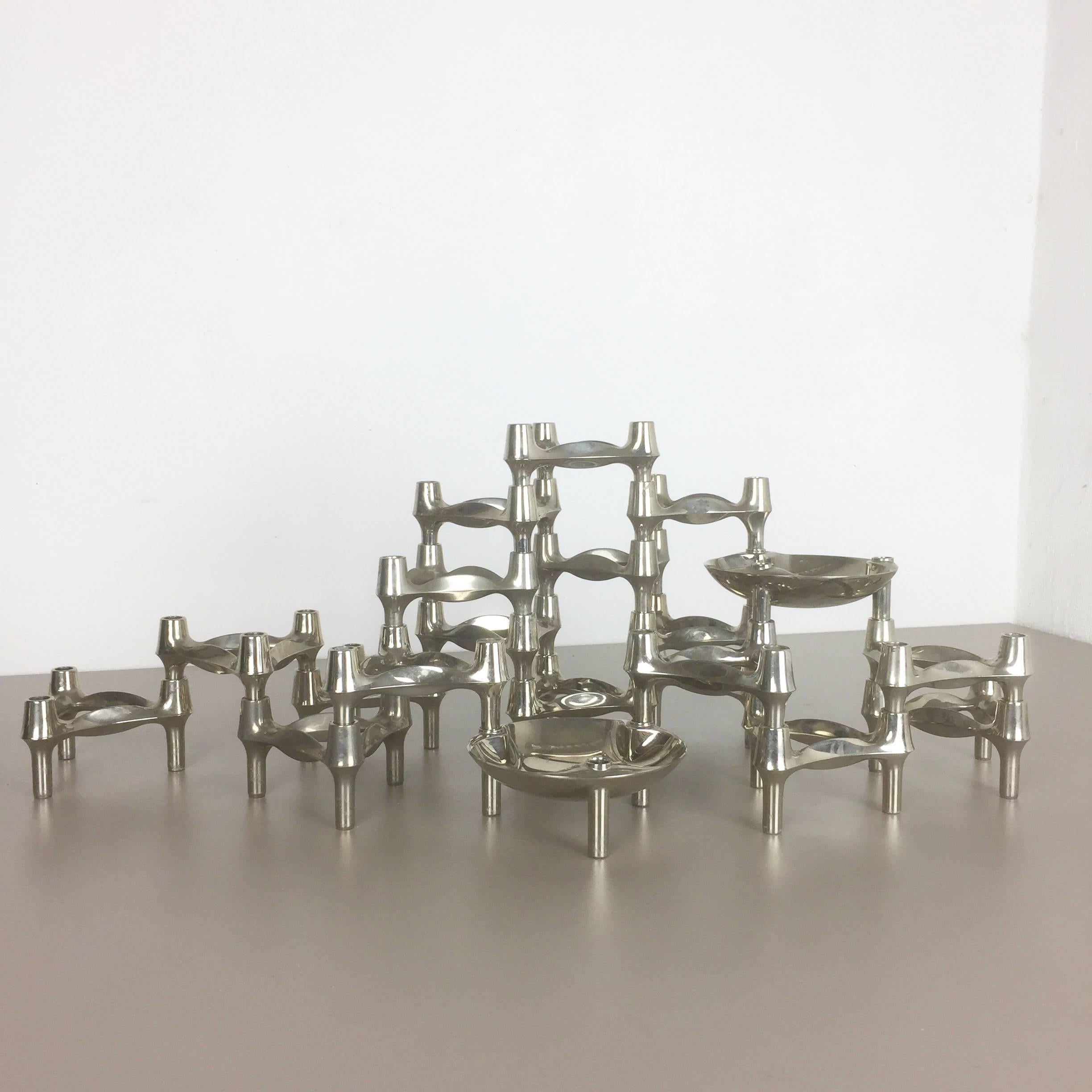Article:

18 metal candleholder elements and two shells


Producer:

BMF Nagel, Germany


Design:

Caesar Stoffi




This original vintage set of 18 metal candleholders and two shells, was produced in the 1970s in Germany by BMF
