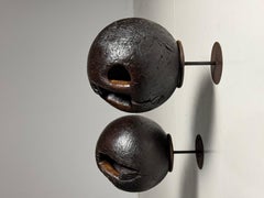 Set of 18th century bowling balls on wooden stand