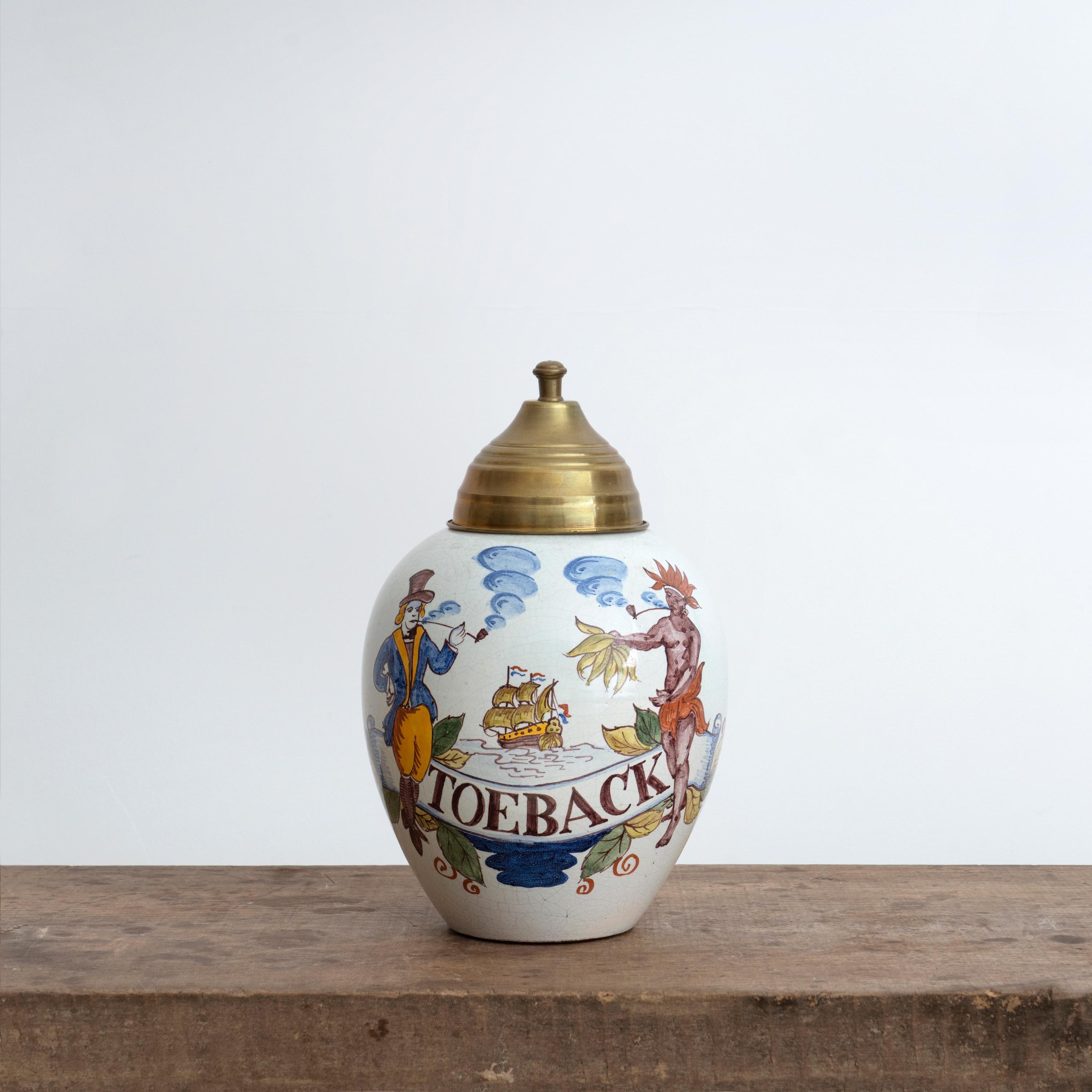 Set of 18th century Dutch ceramic tobacco jars. Crafted in 18th century Delft, these four ceramic tobacco jars are finished with a polychrome glaze and capped with copper lids.