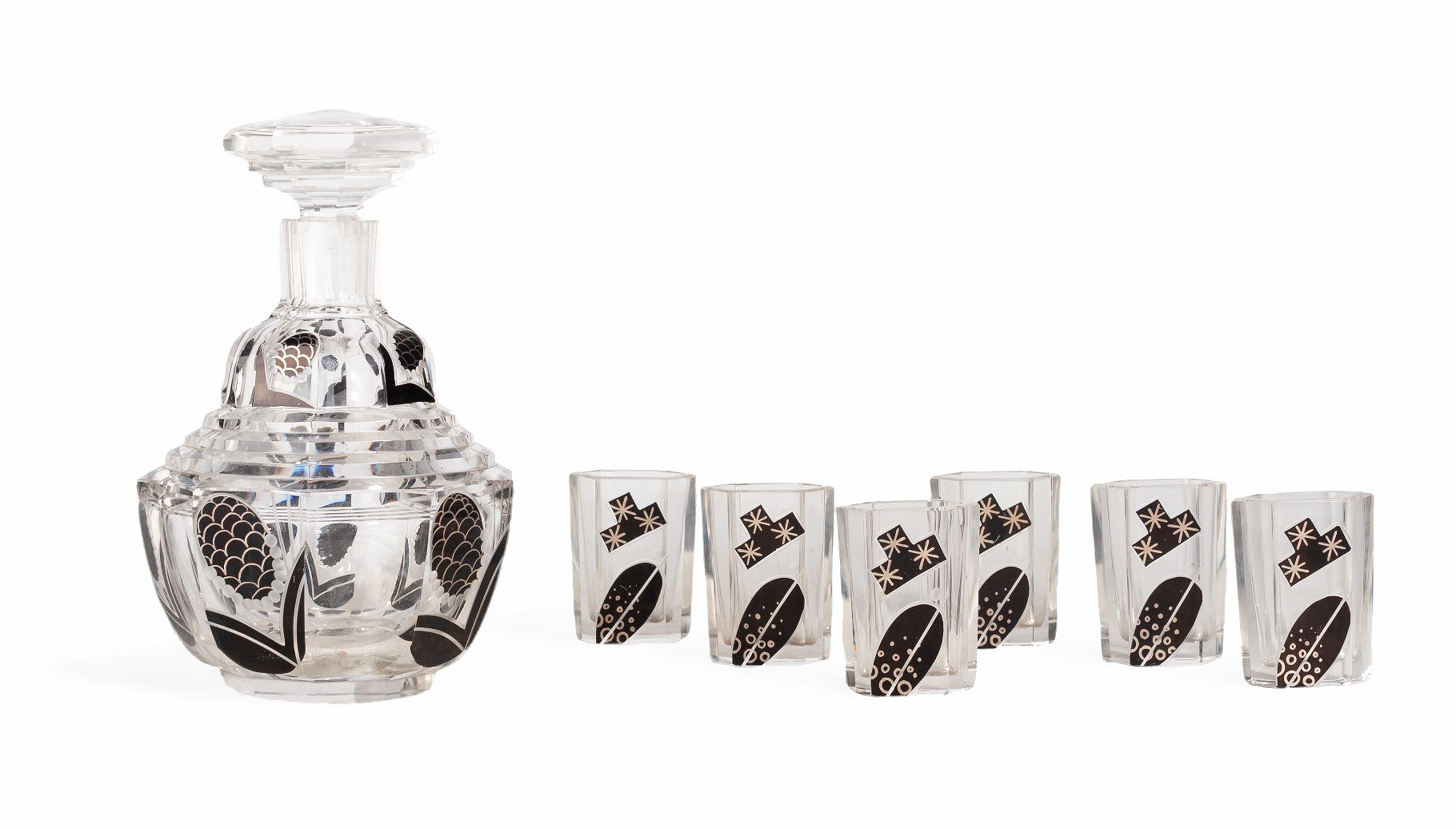 Set of 1930s Art Déco bohemian black enameled crystal decanter with stopper and six glasses by Karl Palda, Czech Republic

By: Karl Palda
Material: crystal, glass, cut glass, enamel
Technique: cast, etched, enameled
Dimensions: 5 in x 8 in
Date: