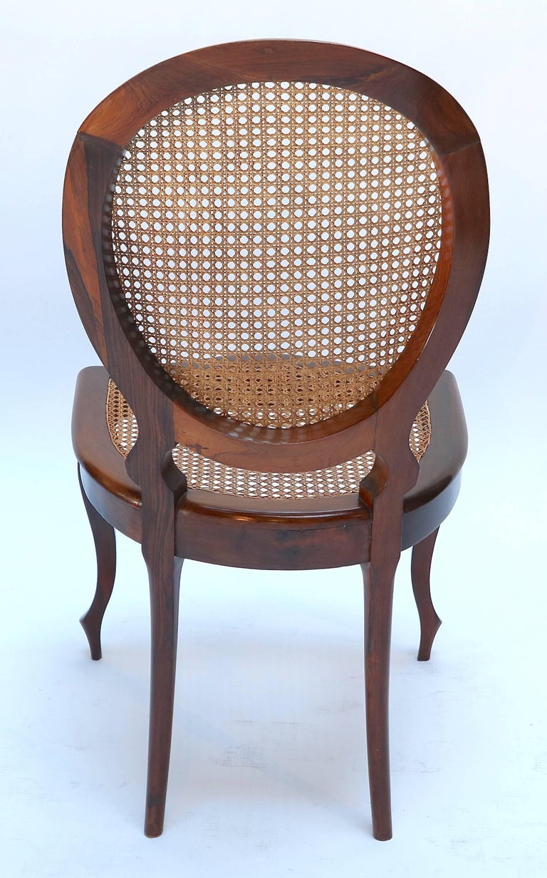 Set of 1940s Brazilian Jacaranda Medallion Cane Dining Chairs In Good Condition For Sale In Los Angeles, CA