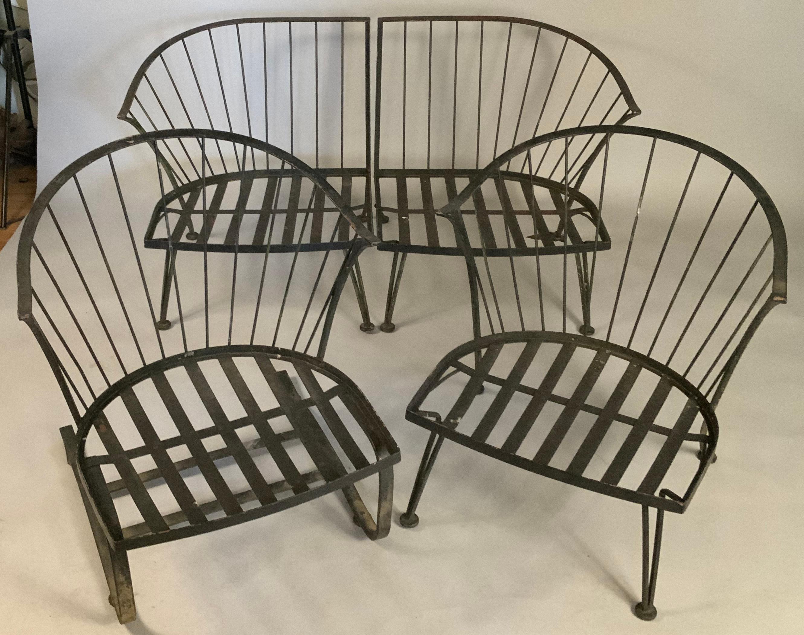 A very nice set of vintage lounge seating from Woodard's Pinecrest collection, circa 1960. set includes a large lounge chair, and a matching large lounge chair on a spring base, along with a two piece sectional sofa. in their original satin black