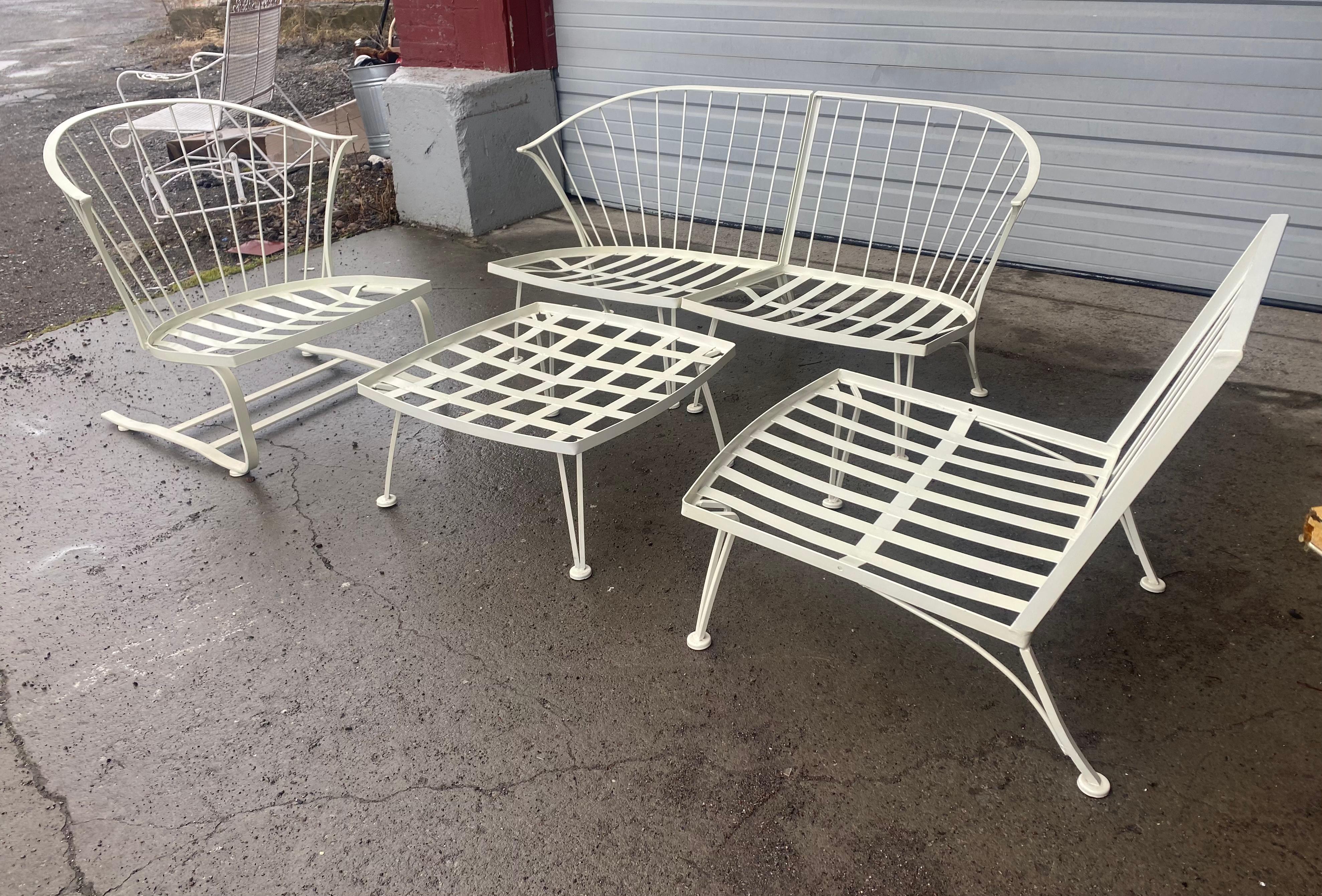 Set of 5-piece 1950's Pinecrest lounge seating by Woodard, alternative seating configurations. ie: 3 seater sofa. 2-seater sofa with separate chair. Extremely rare spring steel arm chair (rocker) and ottoman. Cushions included but in need of
