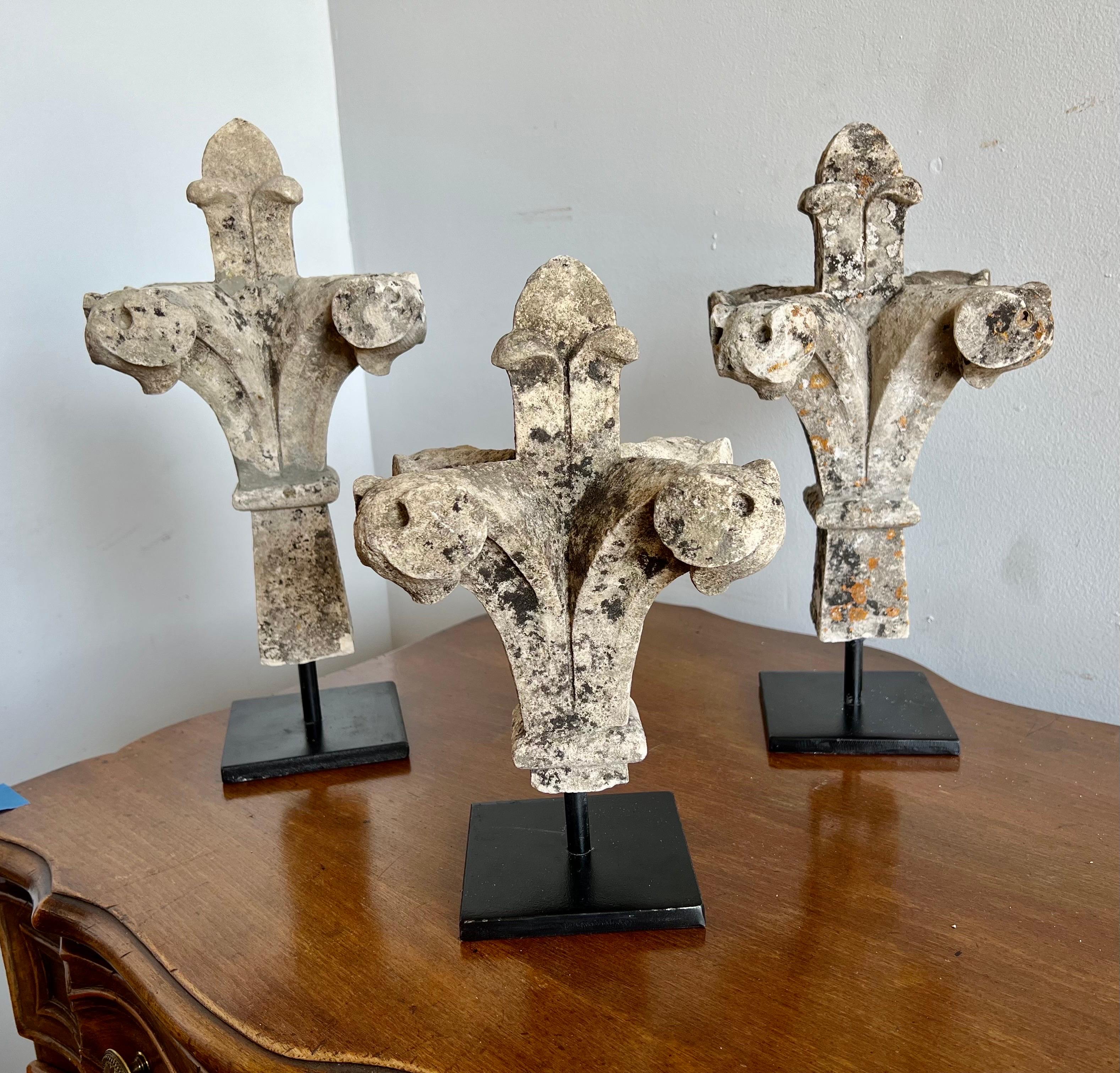 Set of (3) Limestone Finials mounted on Iron bases. The finials are (3) different sizes:
1) 16