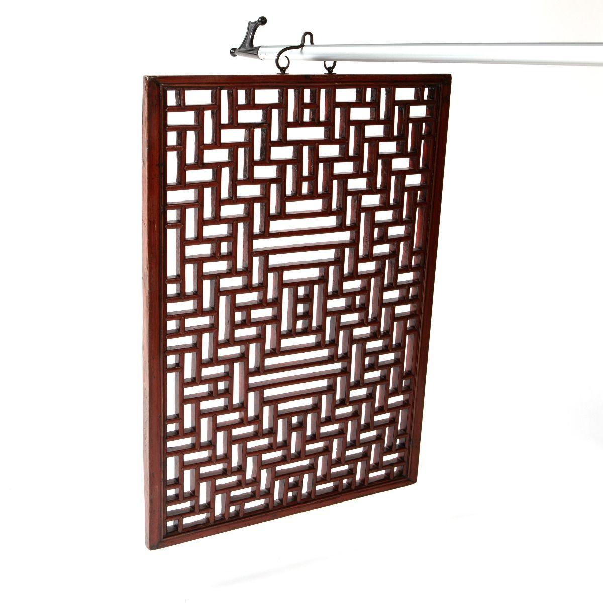 A pair of elegant wall panels, intricately hand-carved in geometric patterns and preserved with their original red lacquer.

They were originally used as interior “windows” between rooms in traditional Chinese homes.

Today, they serve as unique and