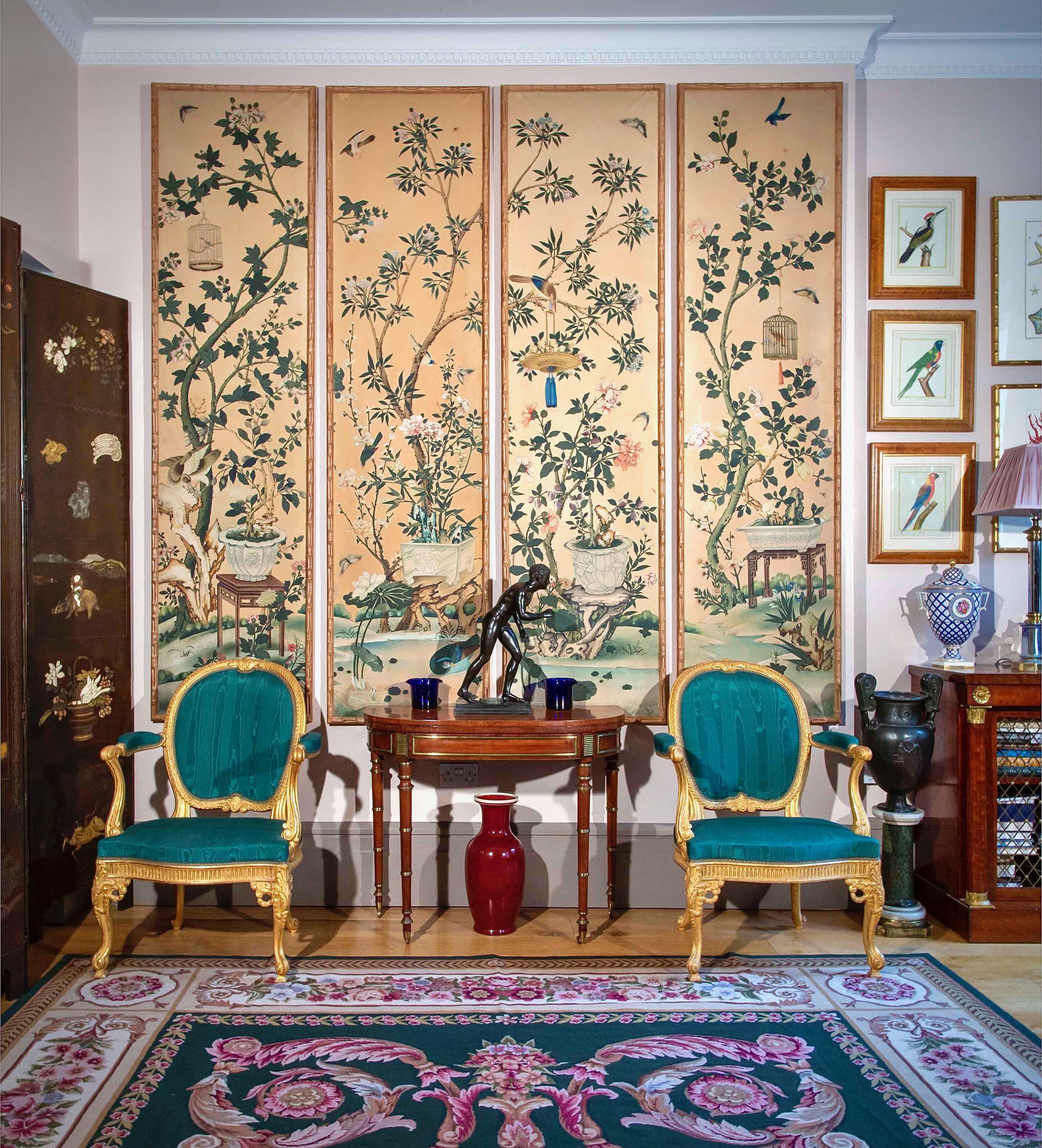 A superbly decorative and rare set of four Chinoiserie wallpaper panels, exquisitely hand-painted with exotic birds and butterflies in the garden, on a pale pink background. Each panel is beautifully framed in a simulated bamboo frame.

China,