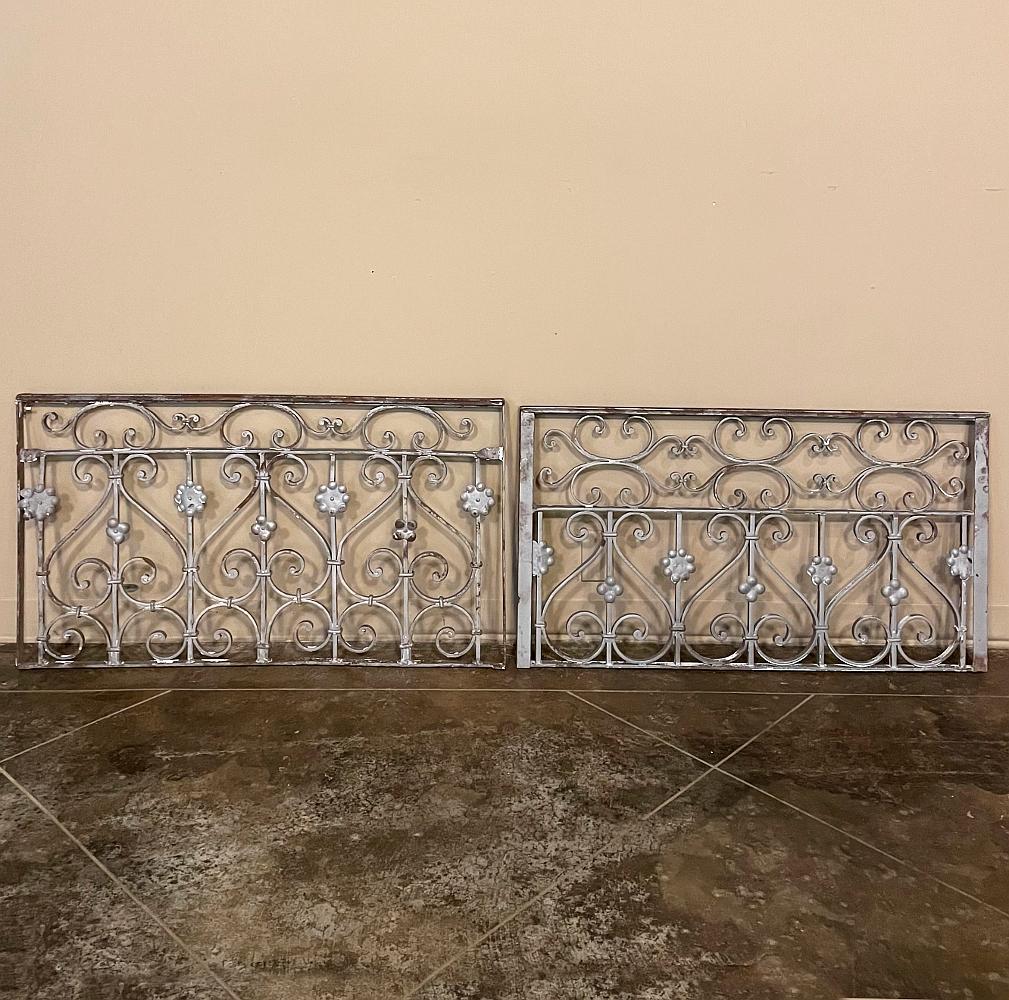 Set of 19th century French wrought iron balustrades ~ window guards were designed to beautify the exterior as well as provide a safeguard railing to the low-hung windows in vogue at the time. This pair were designed to be very complementary but not