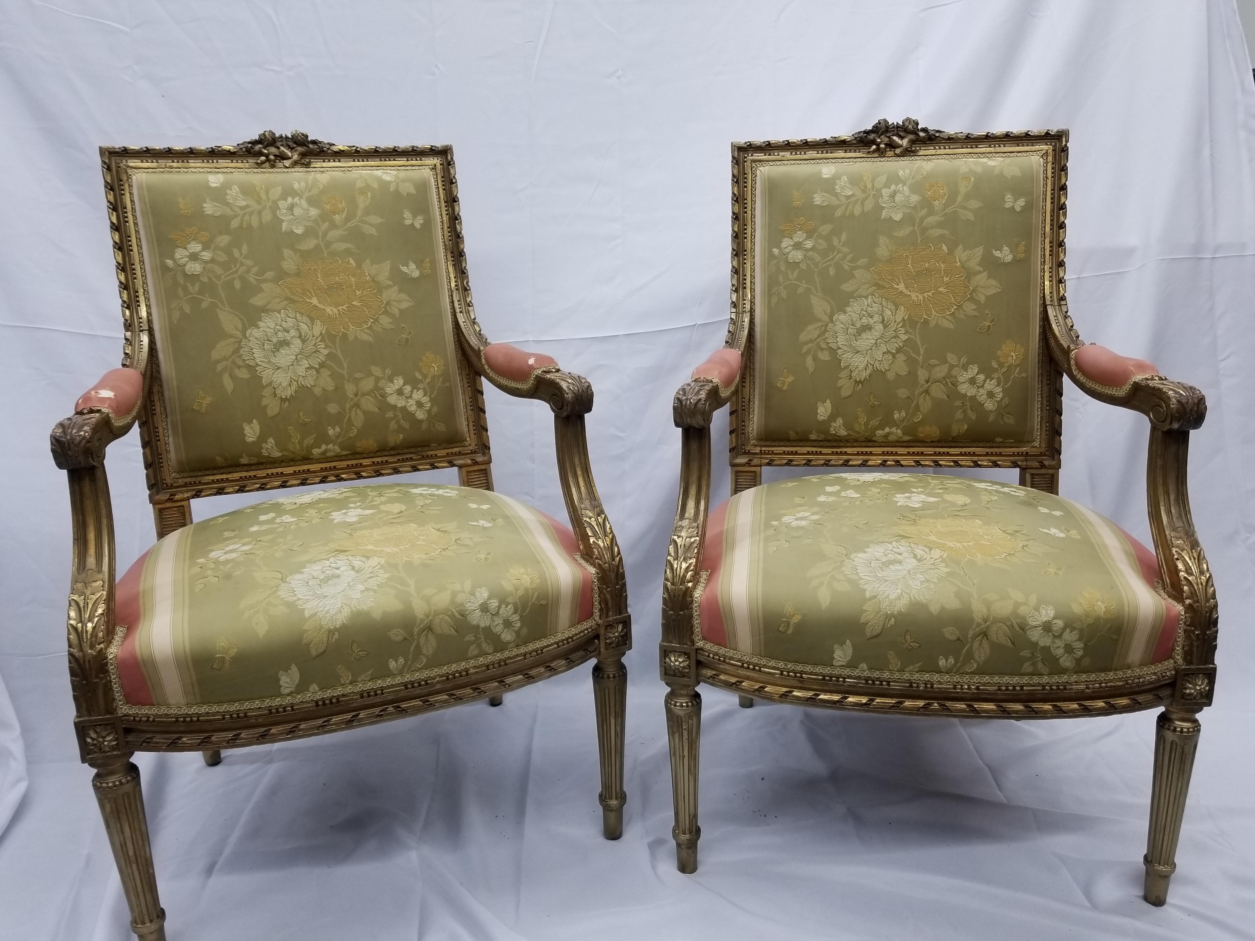 French Louis the 16th style guiltwood salon suite, mid 19th century. Each piece with rectangular back of beaded and guilloche frame with centered foliate crest, two down swept arms with acanthus leaf carved handrests; to swelled aprons. All with