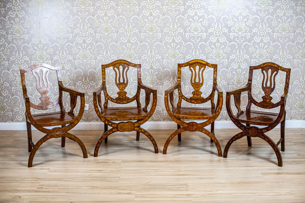 Set of 19th Century Inlaid Walnut Armchairs on X-Shaped Legs

We present you this set of four walnut armchairs from the 2nd half of the 19th century.
The front legs are X-shaped. The upper rails turn into armrests.
Furthermore, the whole surface of